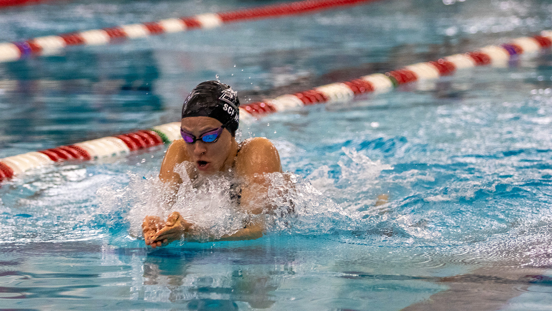 UIndy swimmer Celina Schmidt competing in the breaststroke.