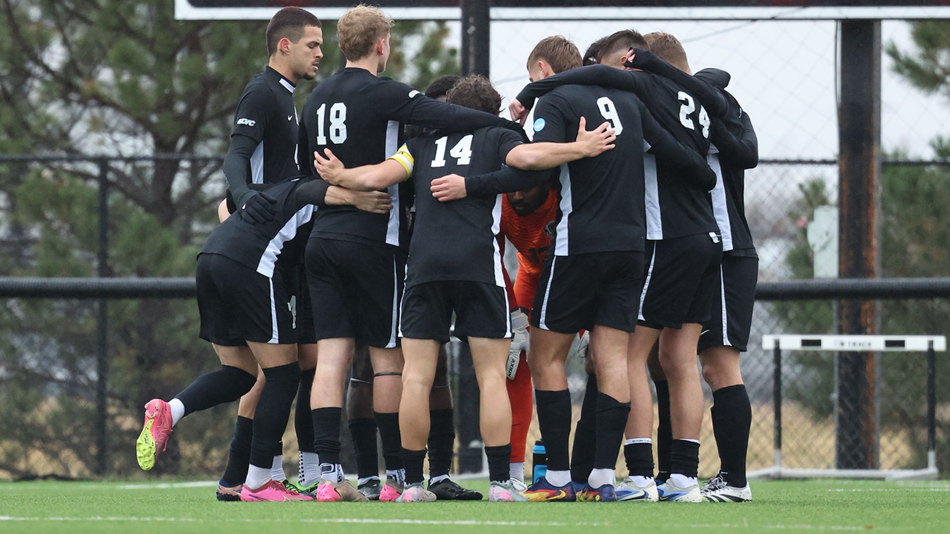 UIndy men's soccer in a huddle before the game