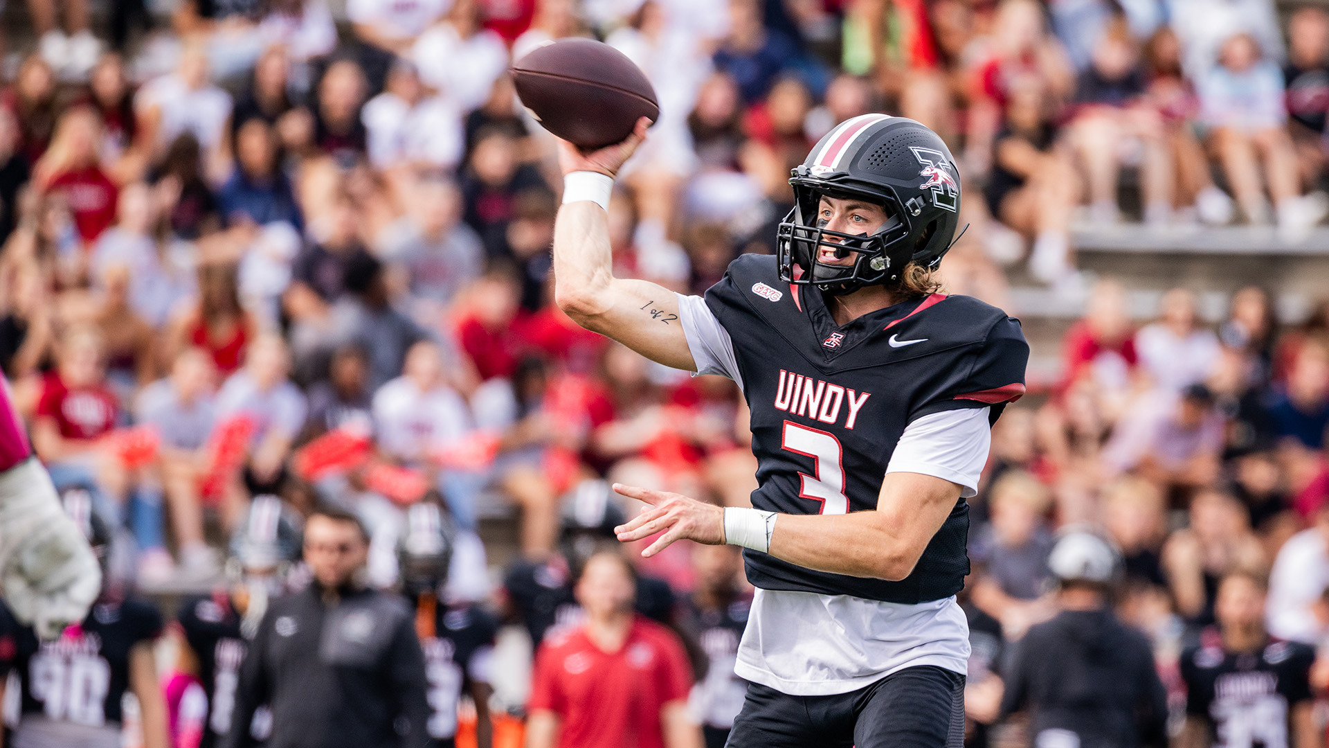 UIndy quarterback Gavin Sukupthrowing a pass.