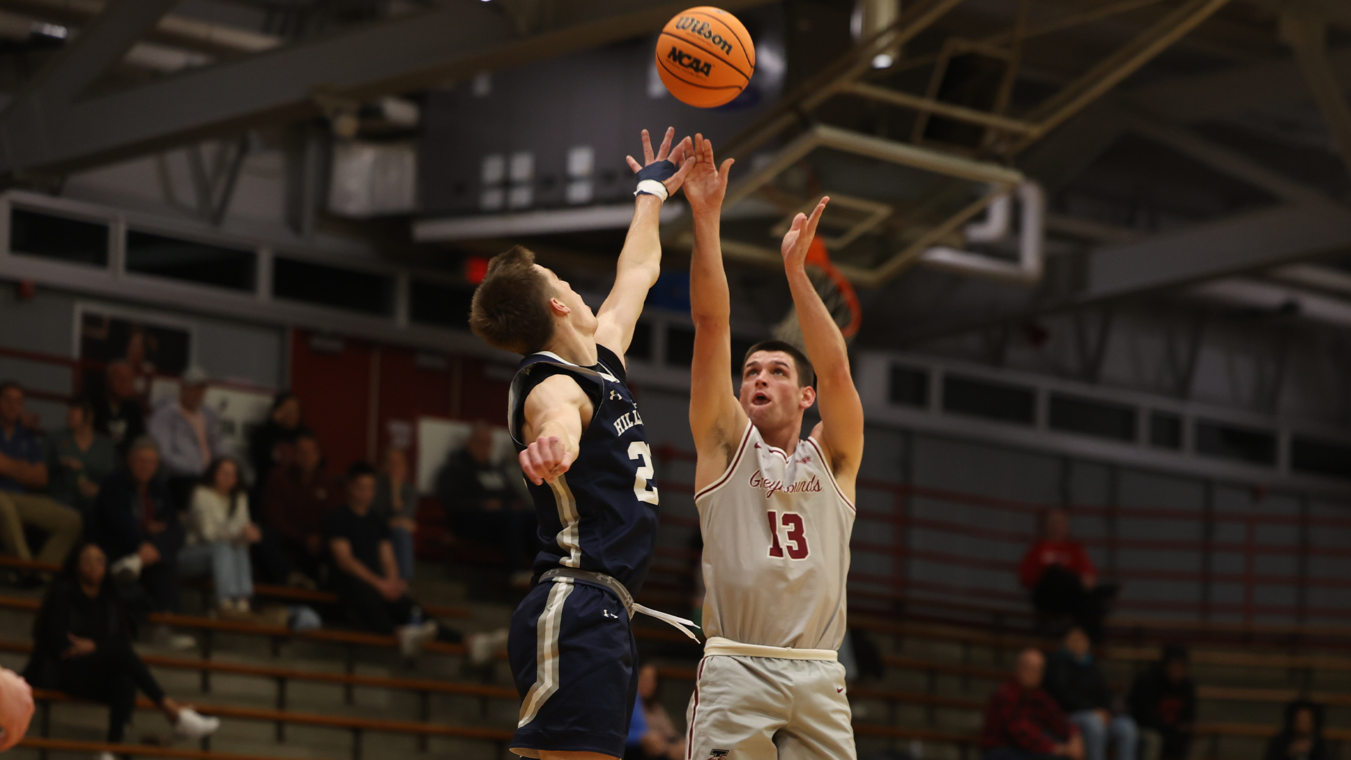 Nate Dudukovich takes a three-pointer against Earlham