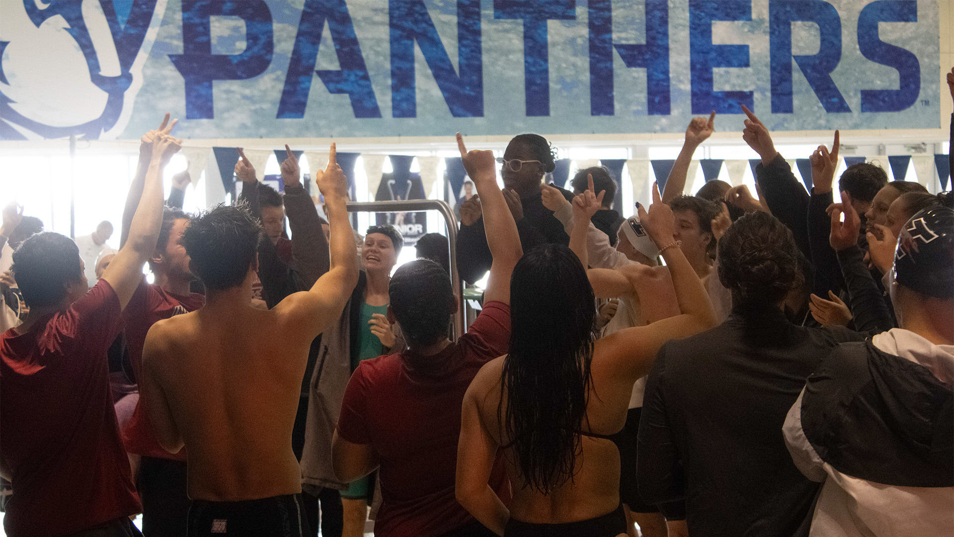 The UIndy swimming & diving team chanting before its dual meet at Eastern Illinois.