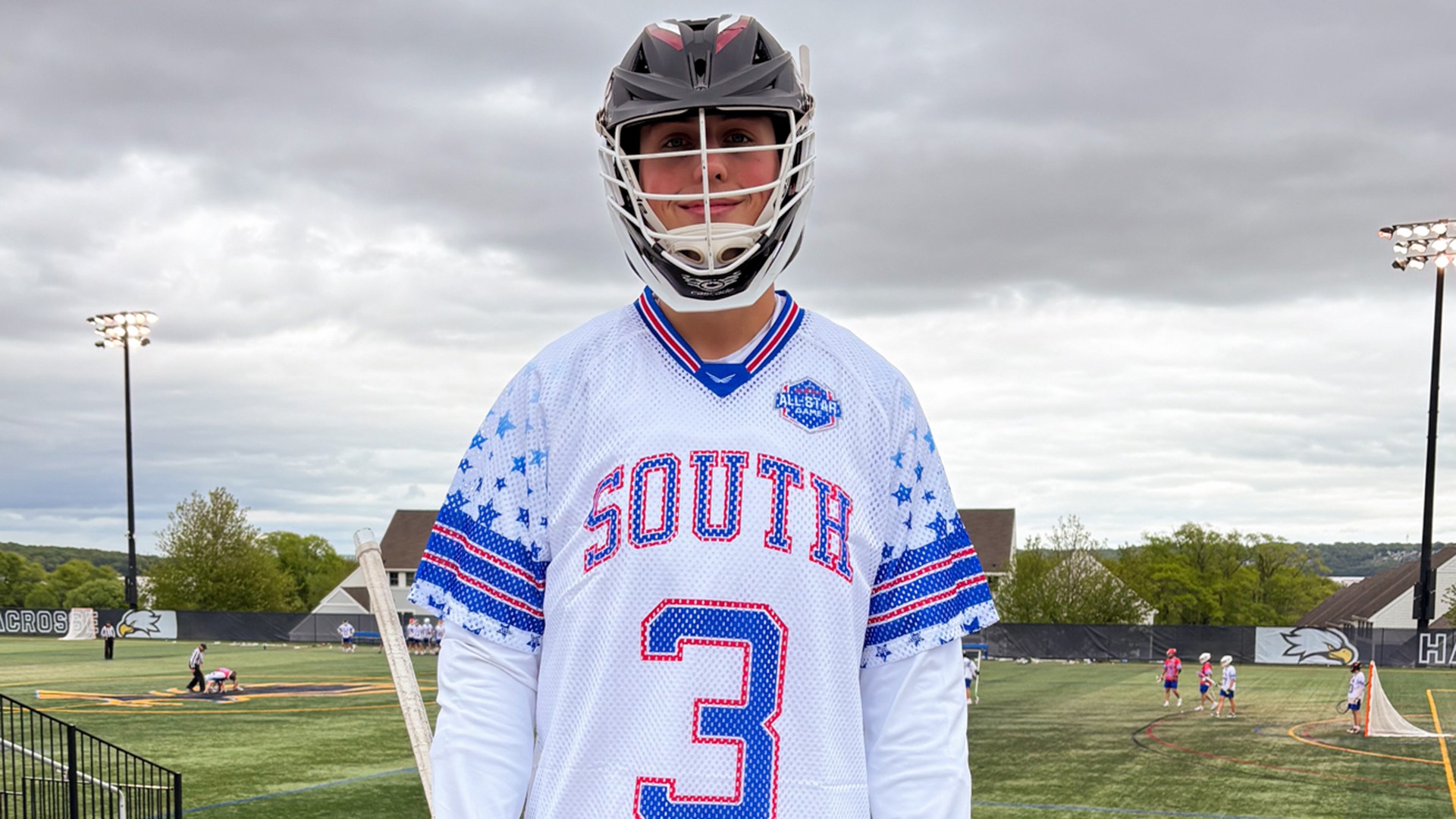 Triston Schaffer poses in front of the field at the Senior All-Star Game