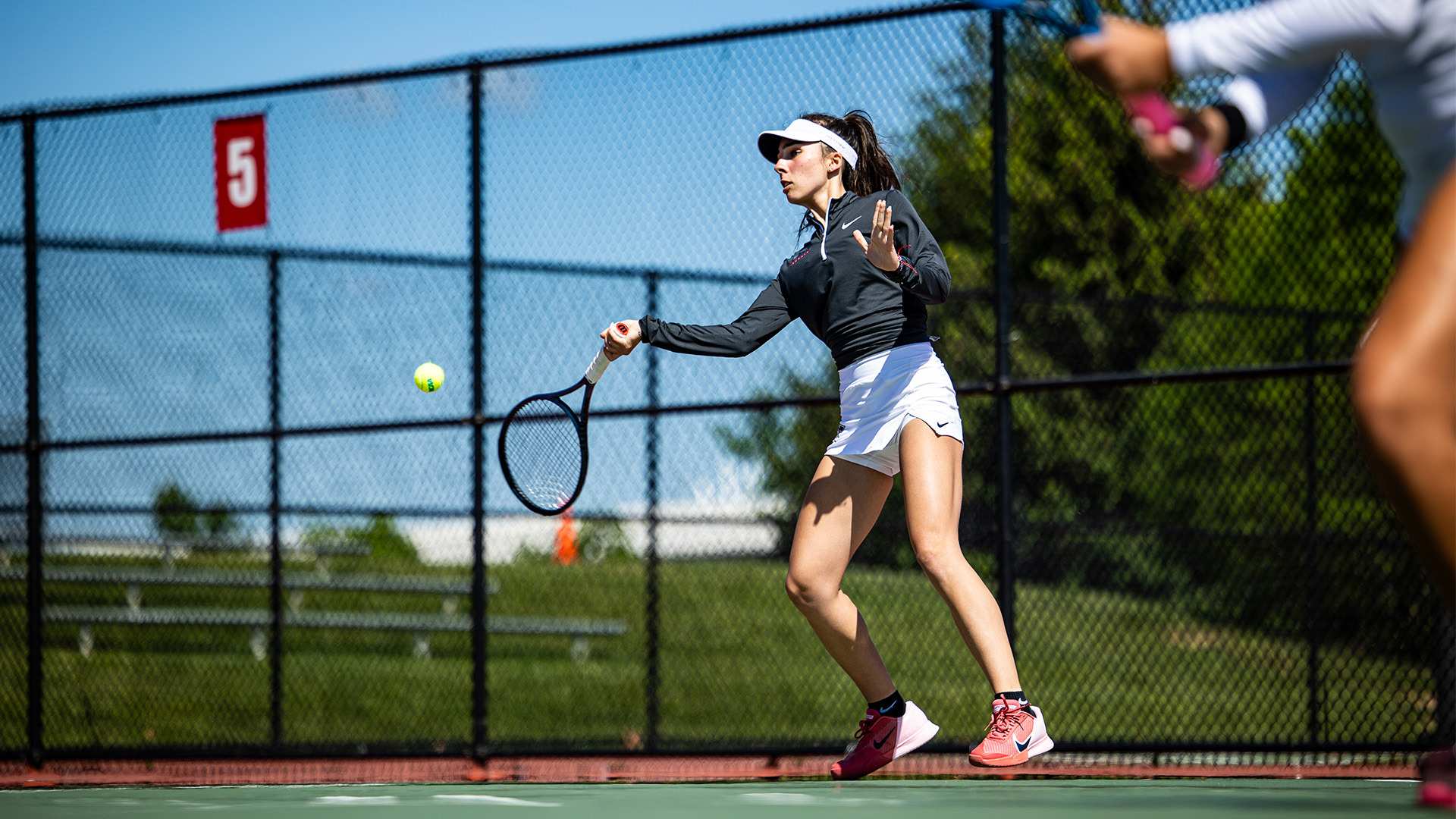 UIndy tennis student-athlete Tyffaine Pais hits a forehand shot.