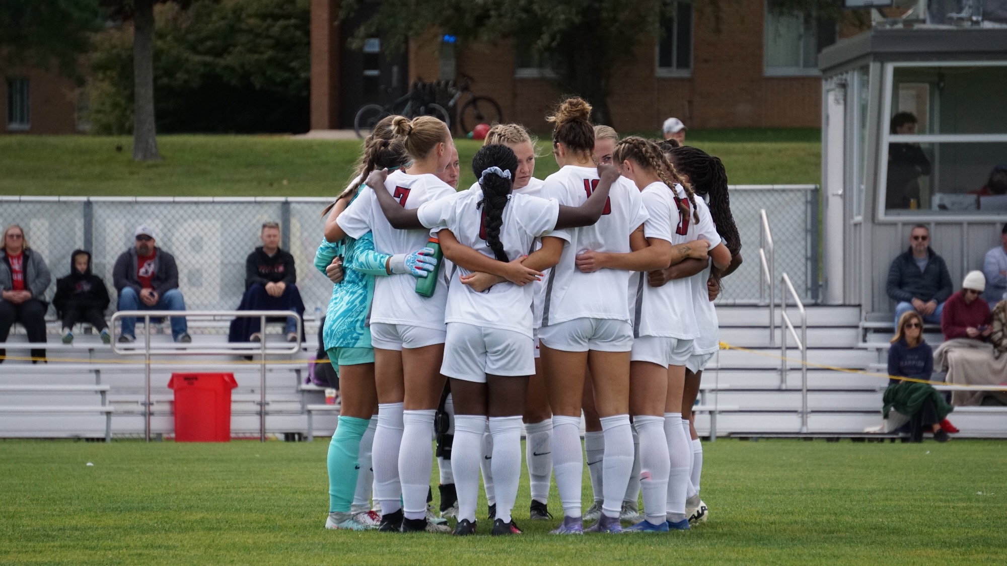 UIndy's team huddling before a game