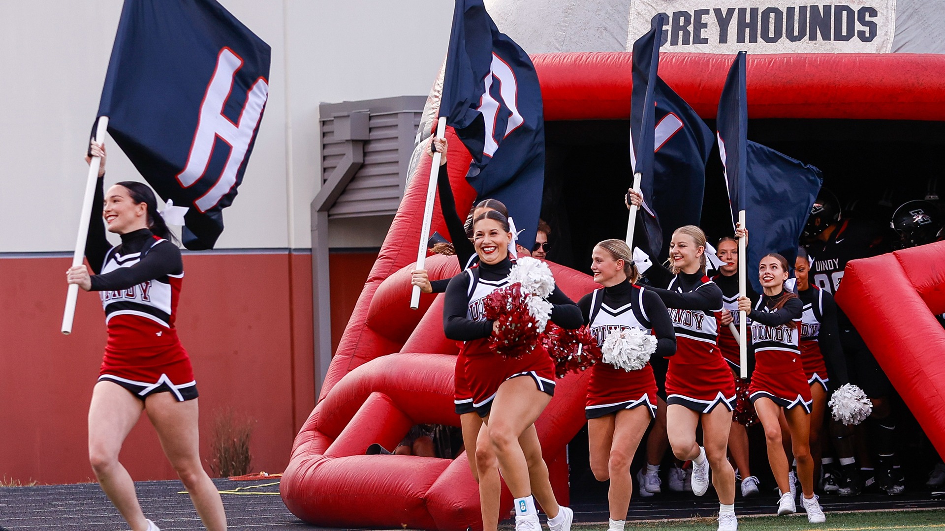 Cheerleading running out of the football helmet.