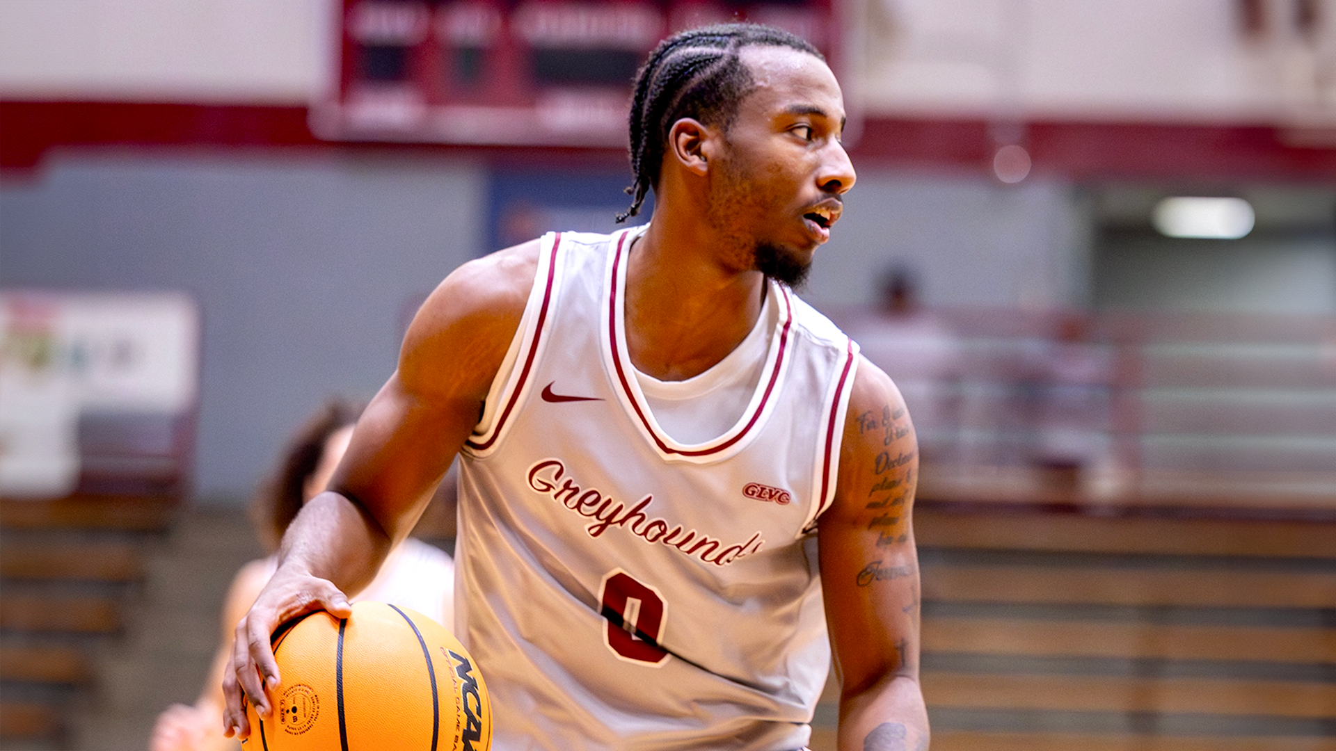 Chase Barnes dribbles the ball up the floor