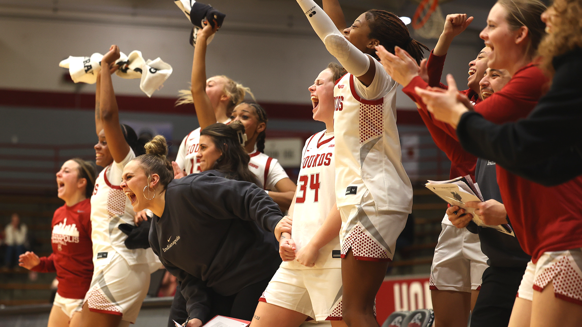 UIndy women's basketball celebrating