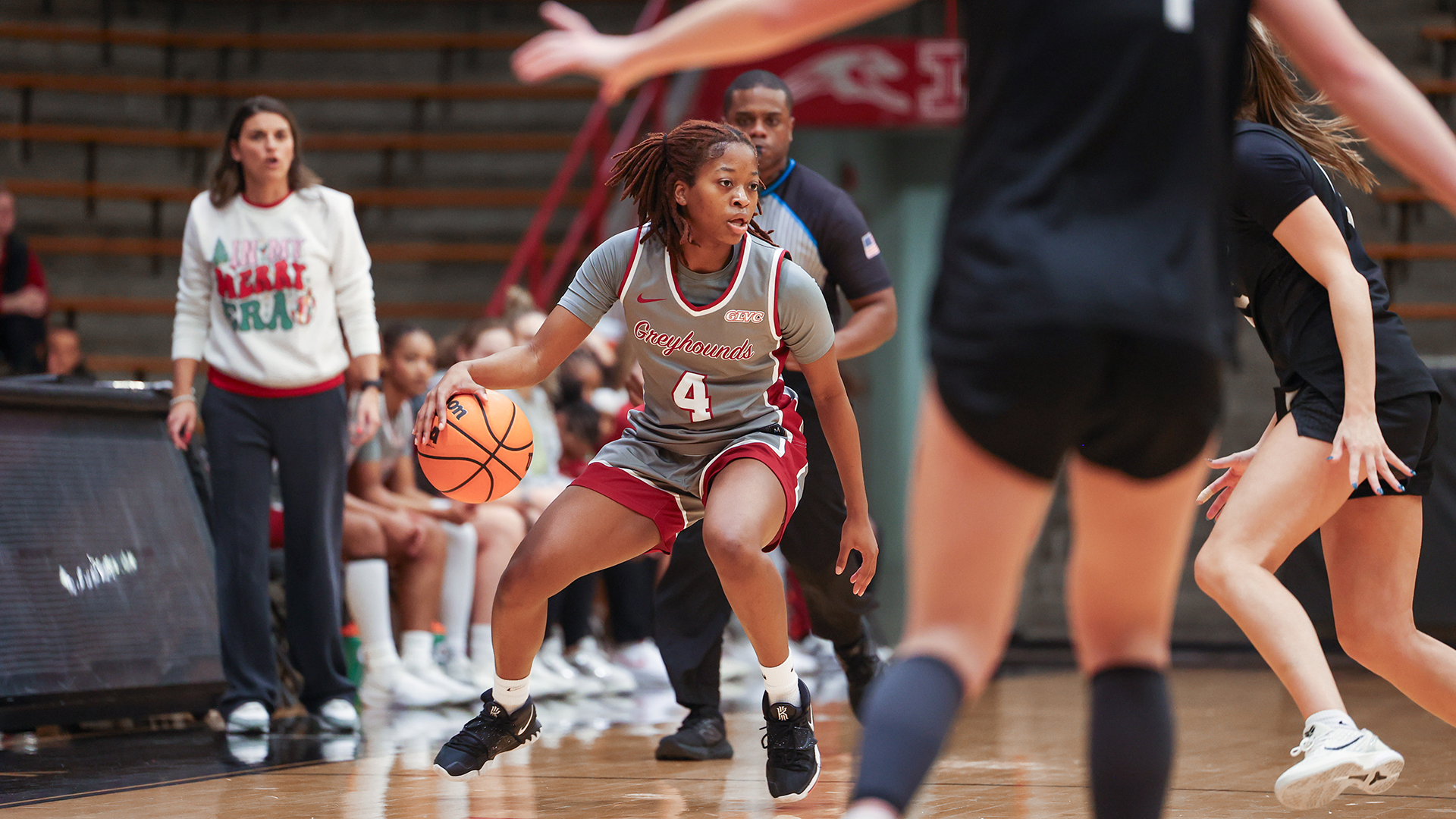 Patricia  brings the ball up the floor 