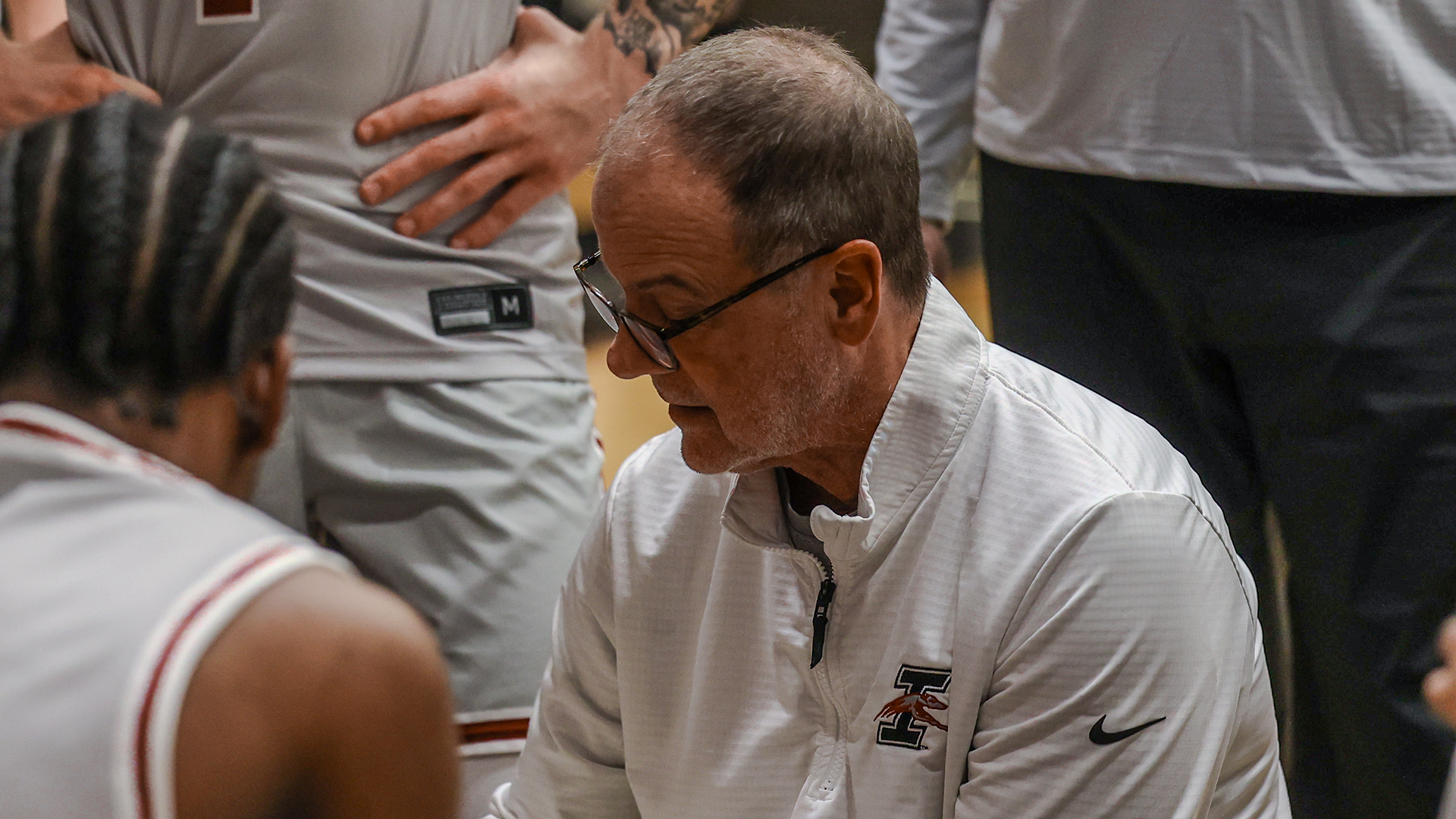 Coach Heady in the huddle 