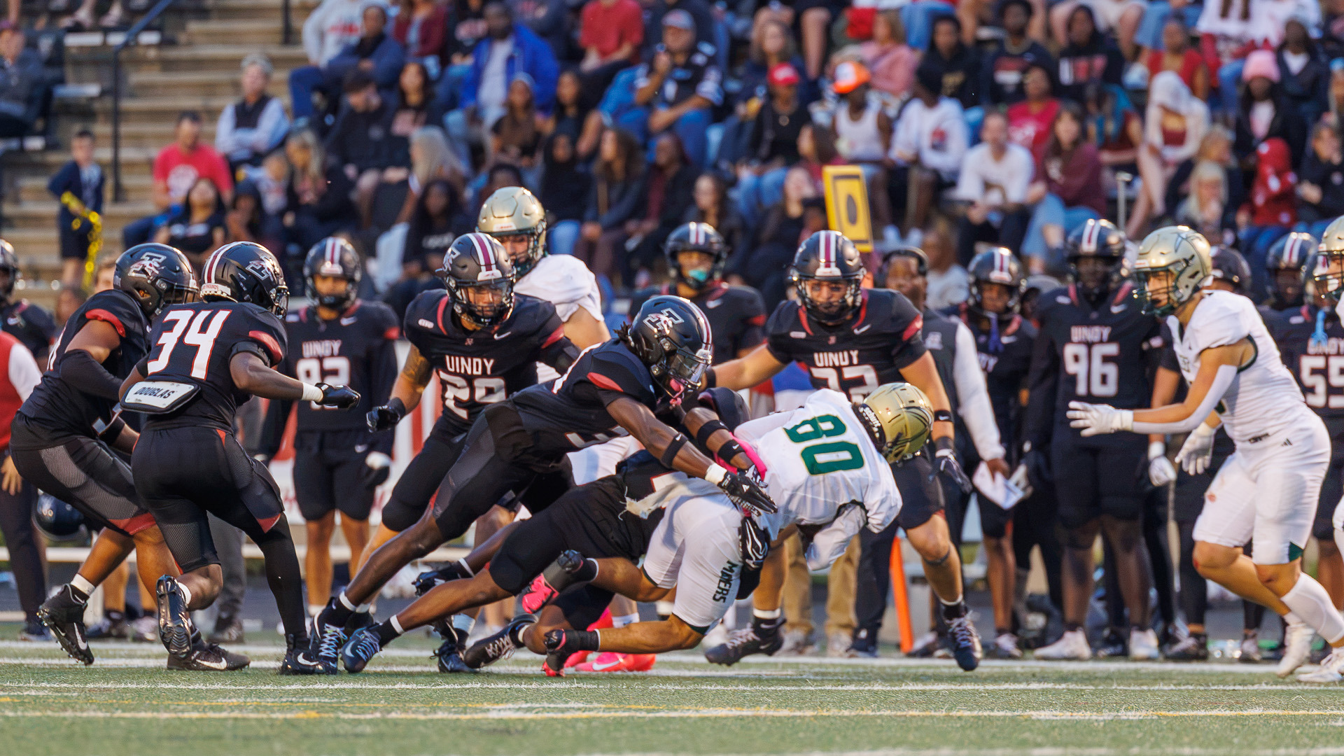 The UIndy football defense swarming a Missouri S&T ball carrier.