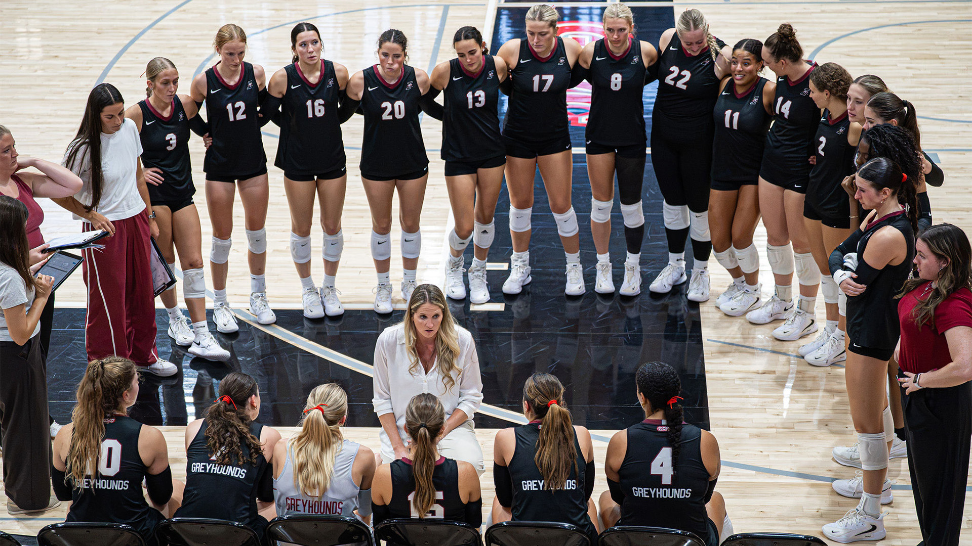 UIndu volleyball head coach Haley Case talking to her team during a timeout.