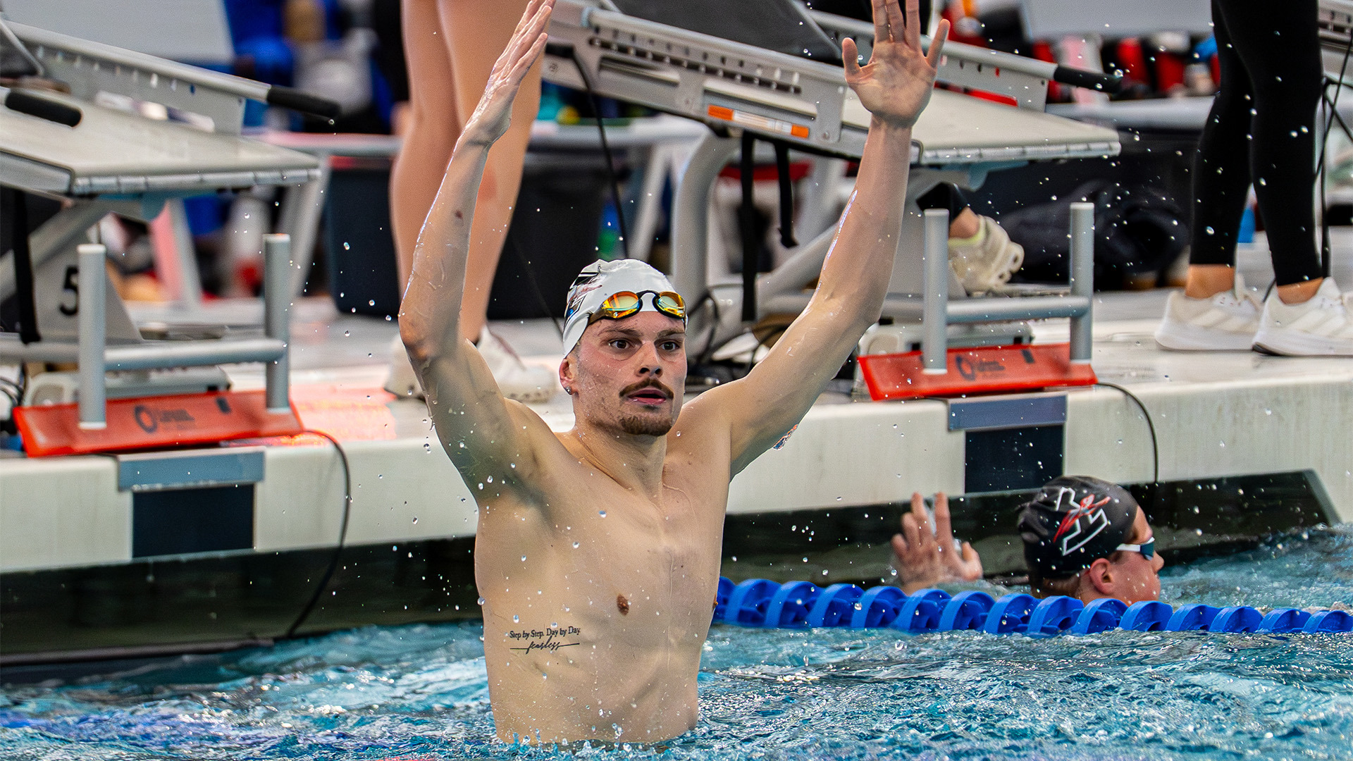 UIndy swimmer Swann Plaza celebrates his 1000 free victory at the 2026 GLVC Championships.
