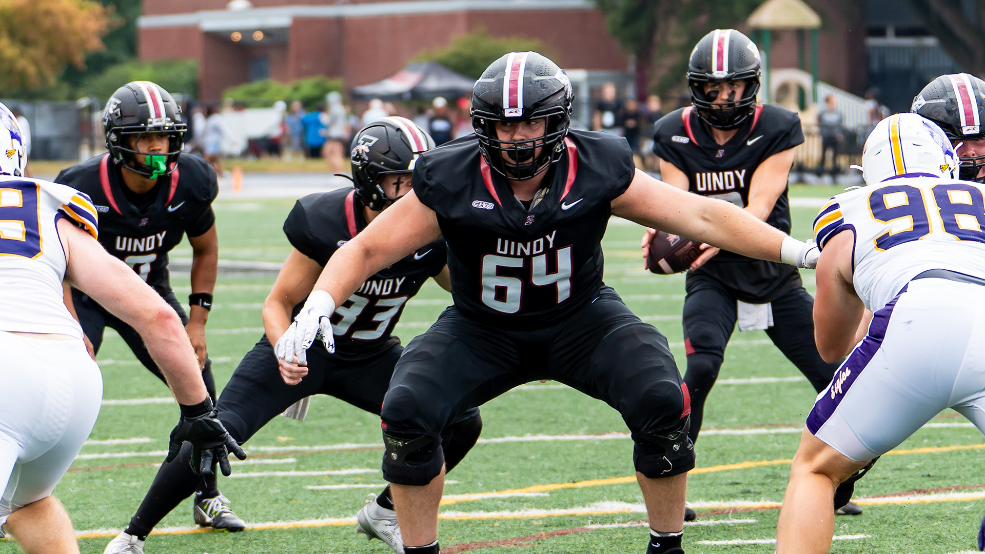 UIndy offensive lineman Ryne Buttz blocking.