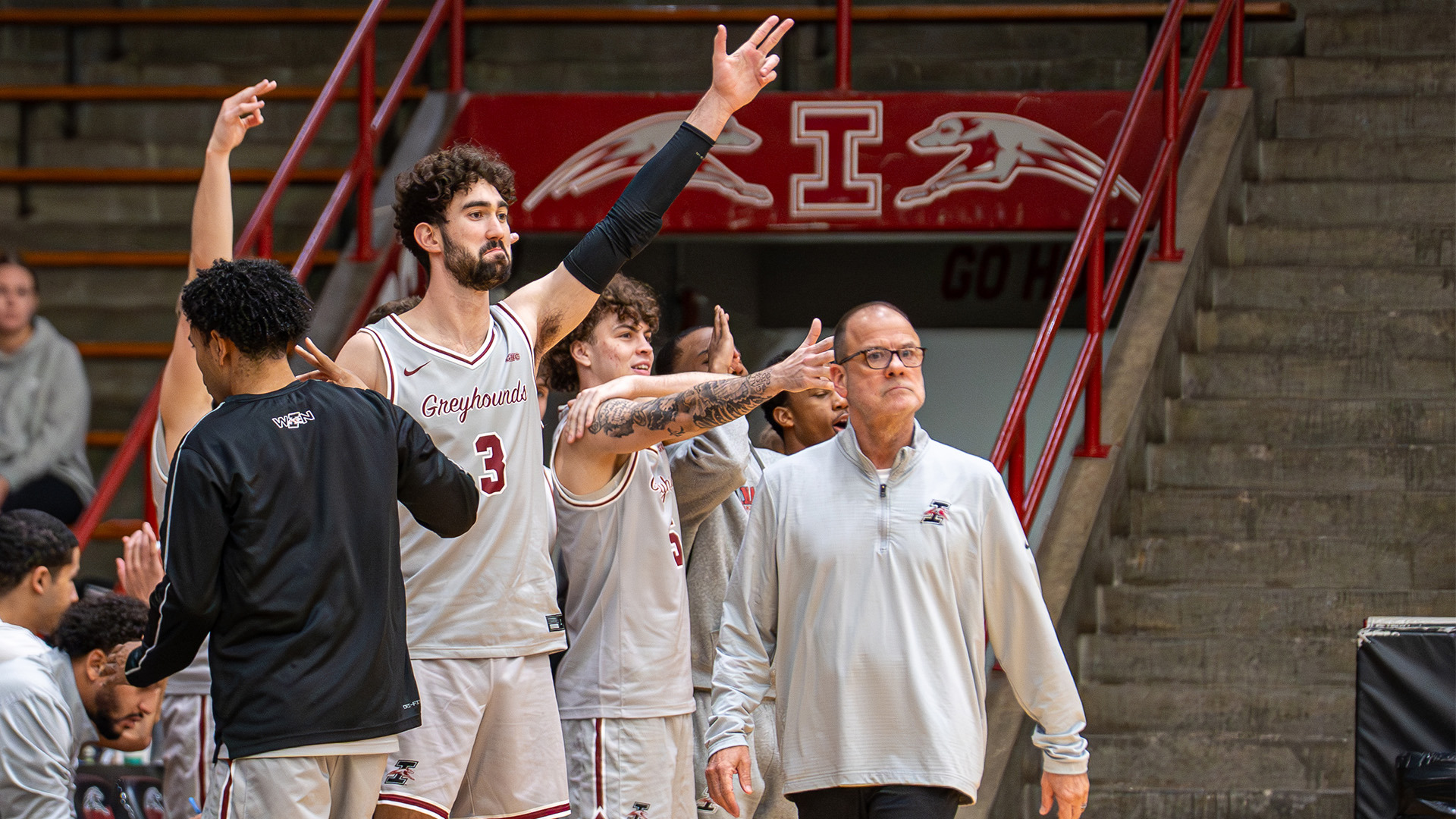 UIndy men's basketball bench celebration