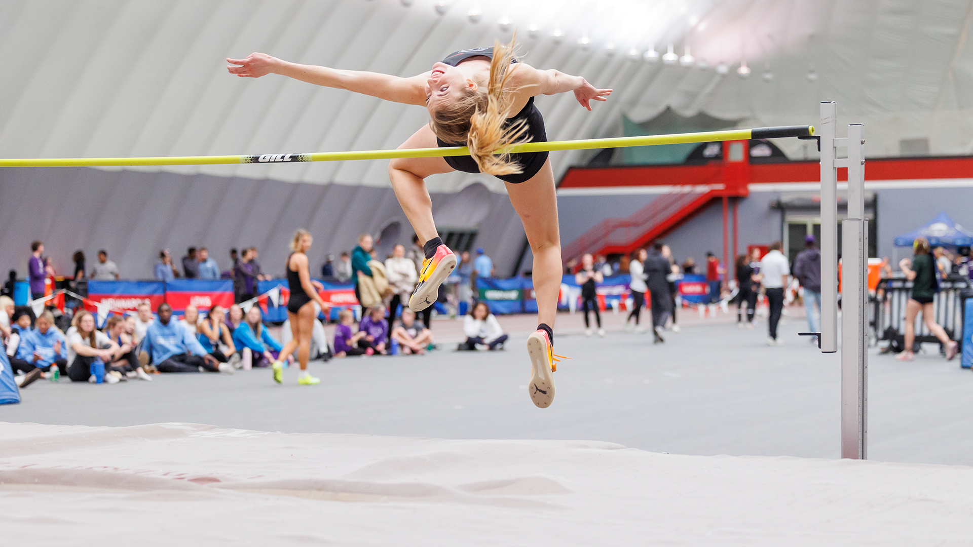 Francesca Maurino high jumps at the GLVC Championships