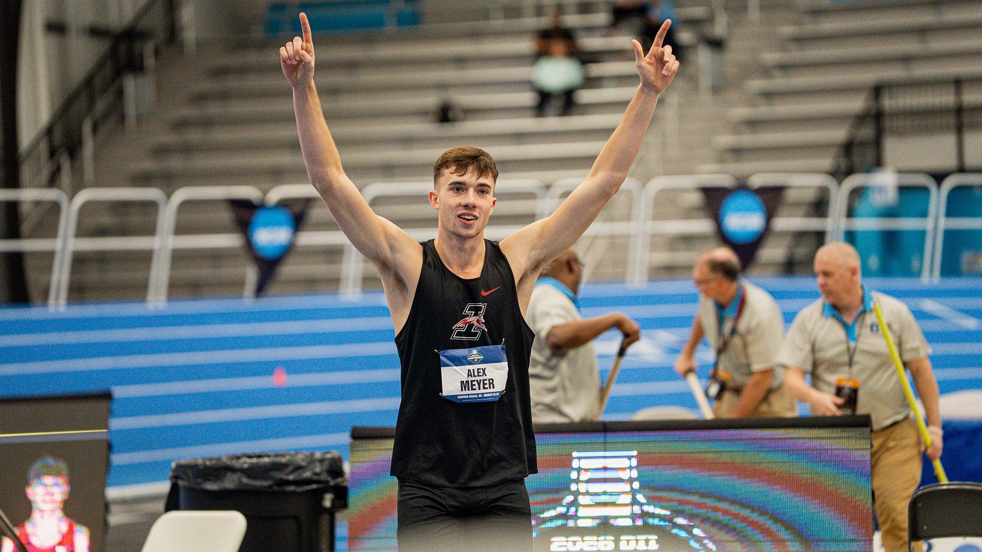 Alex Meyer celebrates winning the 2026 Indoor T&F men's long jump title 