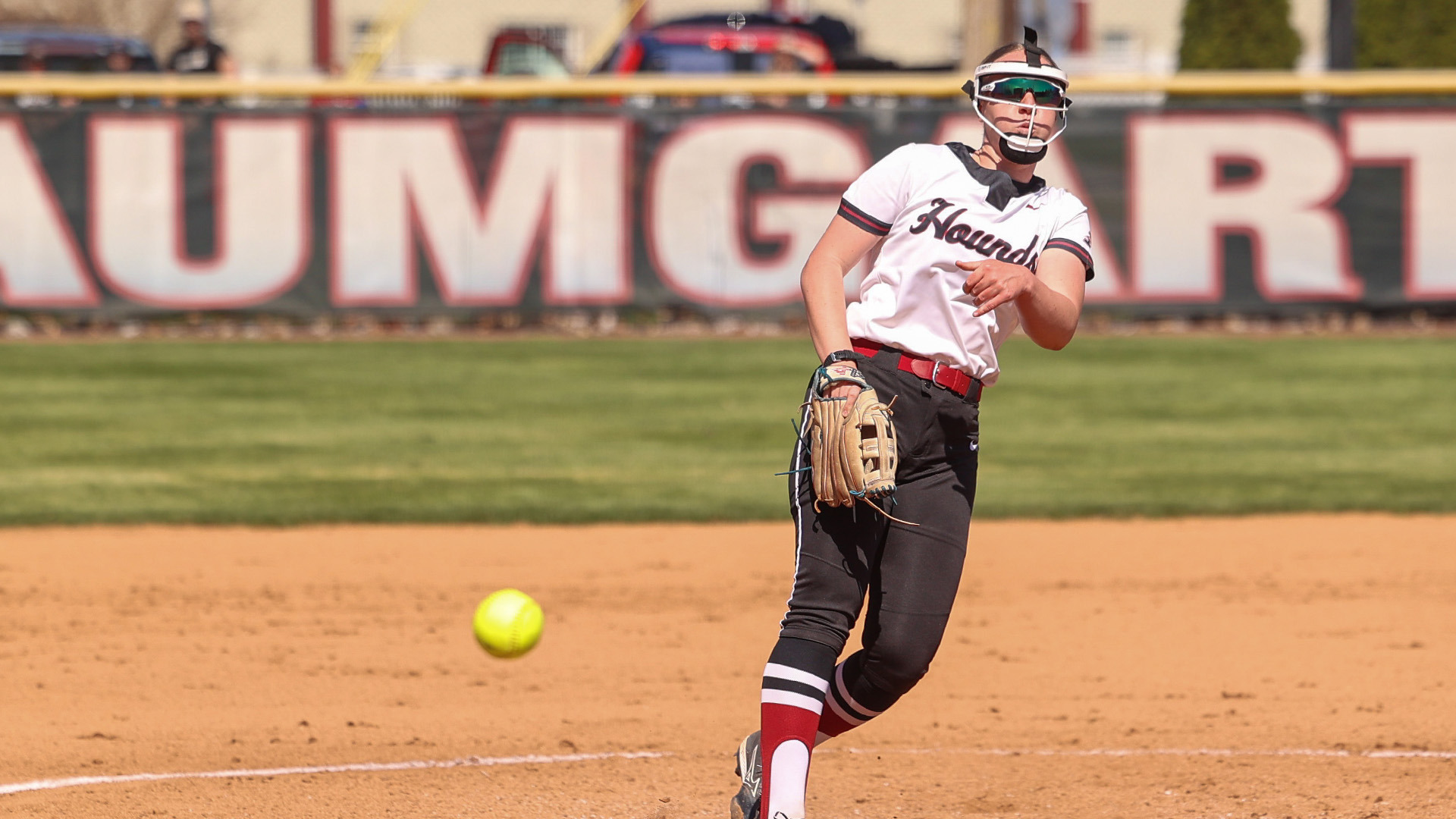 Caitlin Bunte todding a pitch in the Hounds' 2026 home opener versus William Jewell.