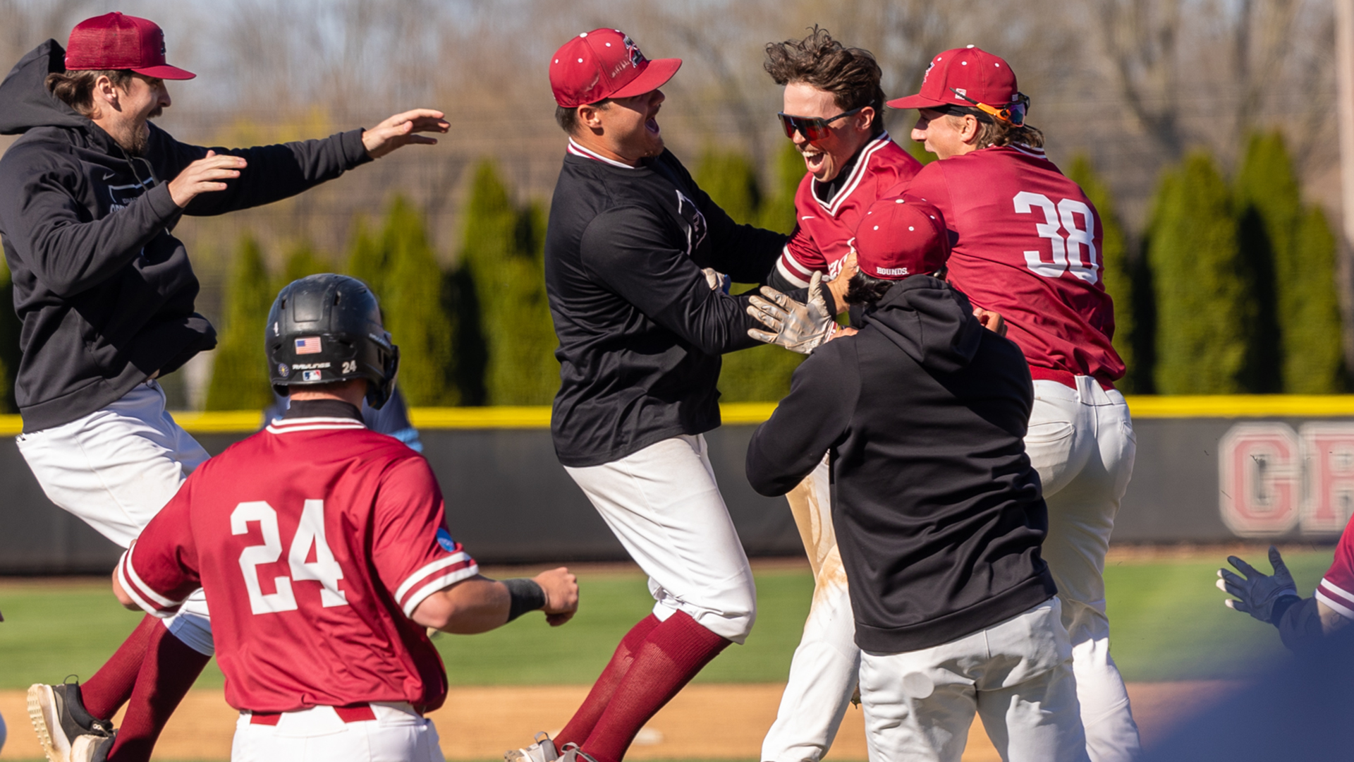 UIndy Baseball Celebrating Chase Mason's walk off hit