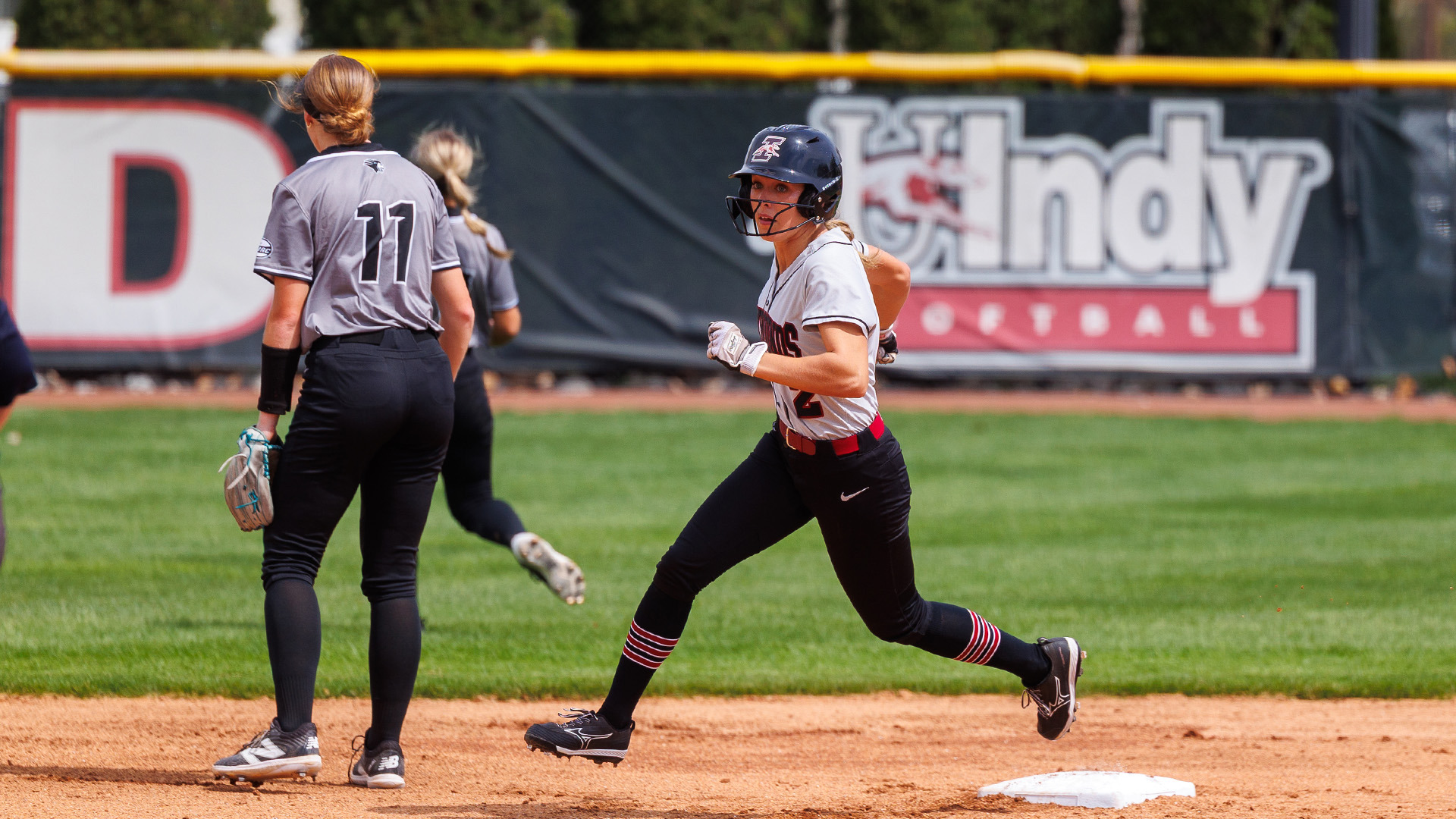 UIndy freshman Christina Stankus rounding second base.
