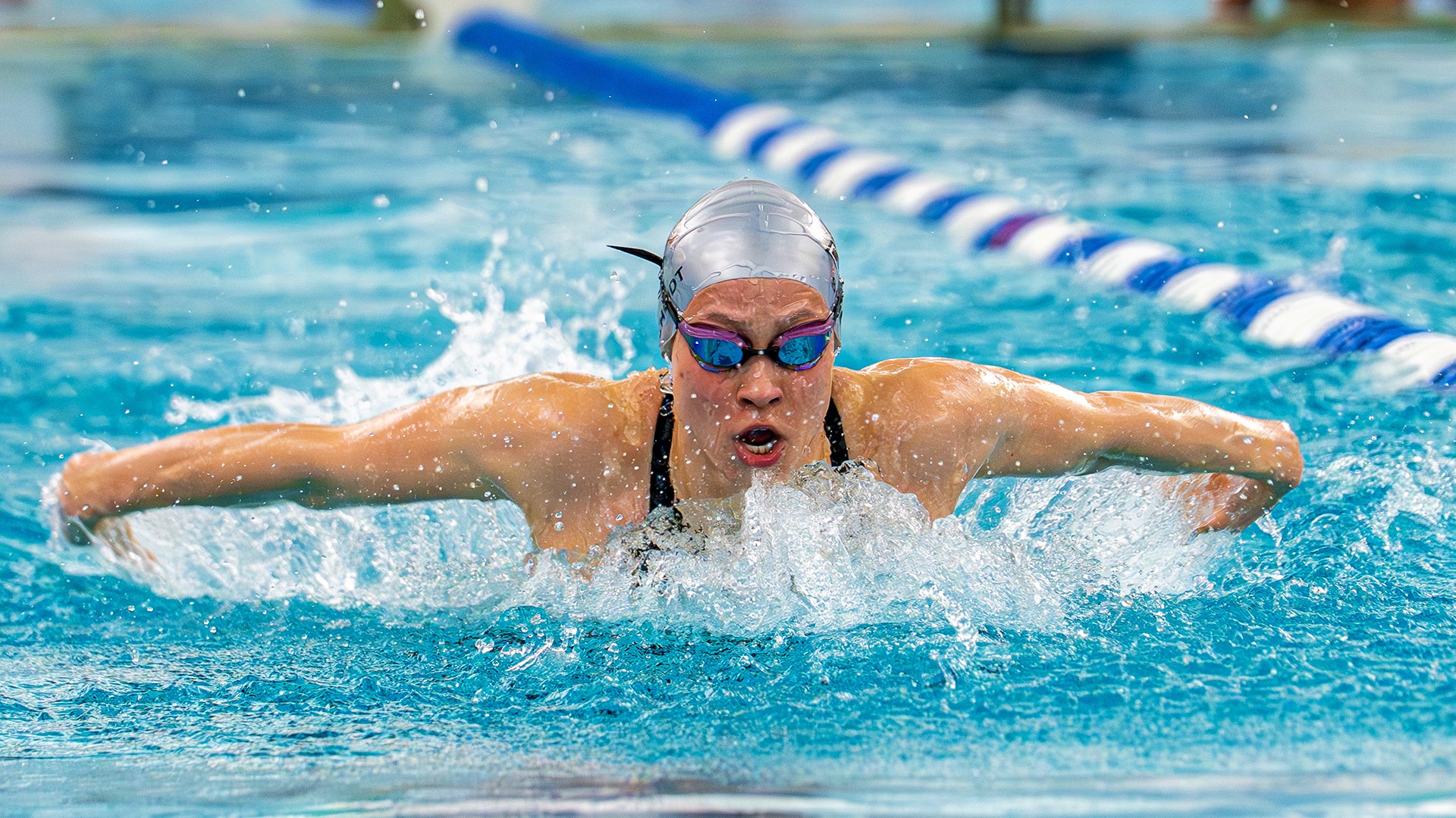 Celina Schmidt swimming the butterfly stroke.