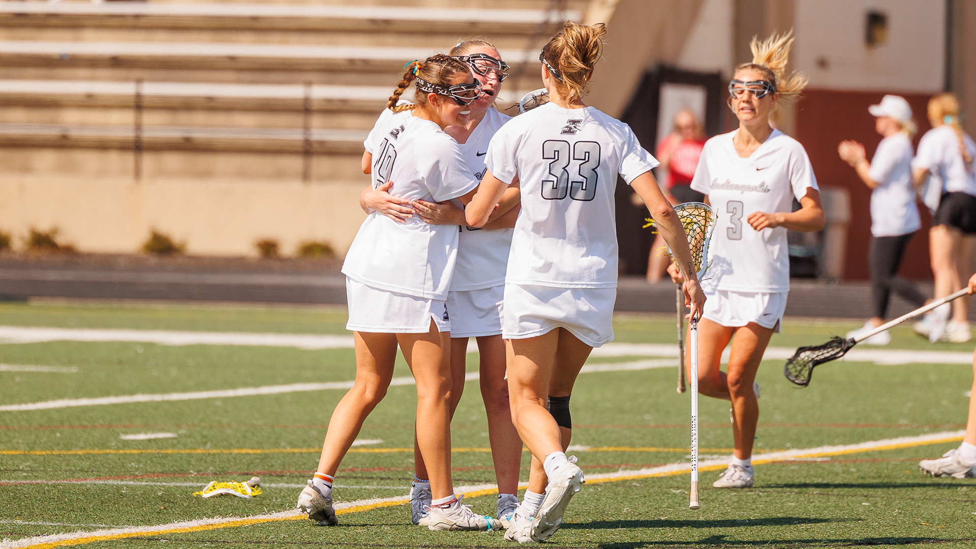UIndy women's lacrosse celebrating a goal