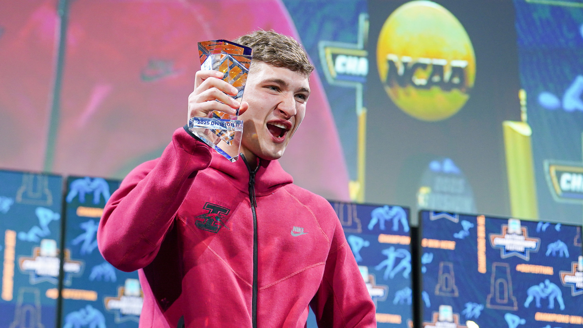 UIndy wrestling student-athlete Jackson Hoover celebrates winning the NCAA Elite 90 Award.