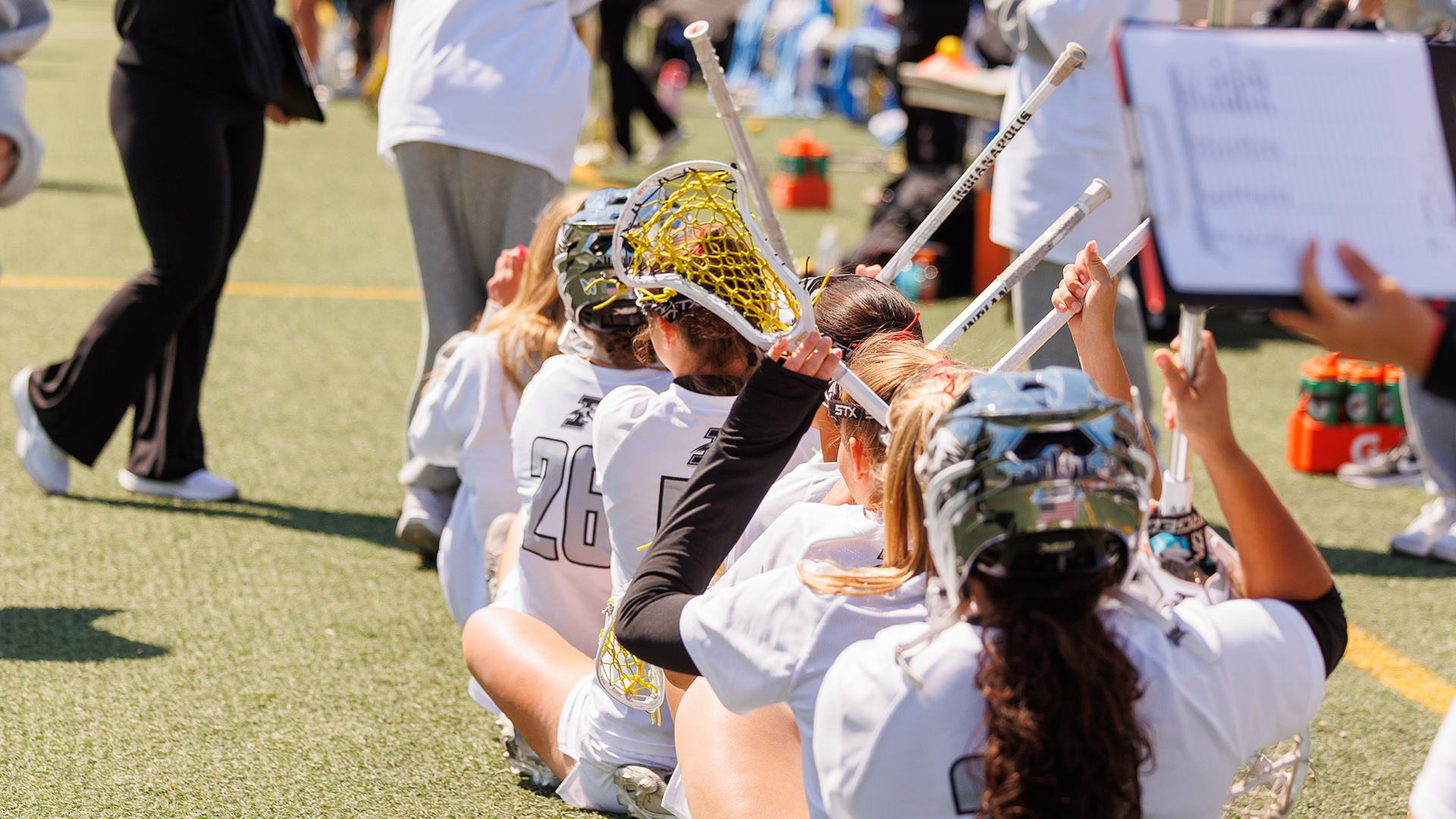 WLAX Team Celebrating on the sideline