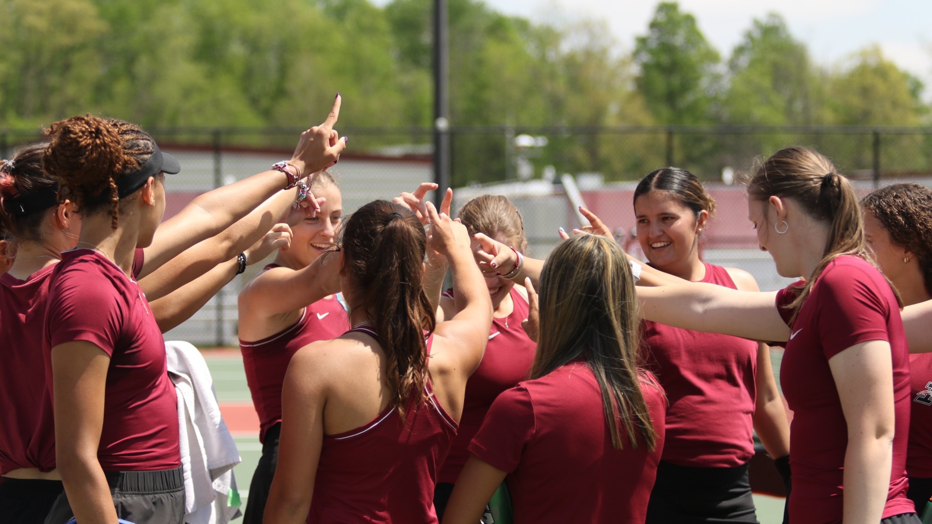 Women's Tennis huddle after a win vs. McKendree