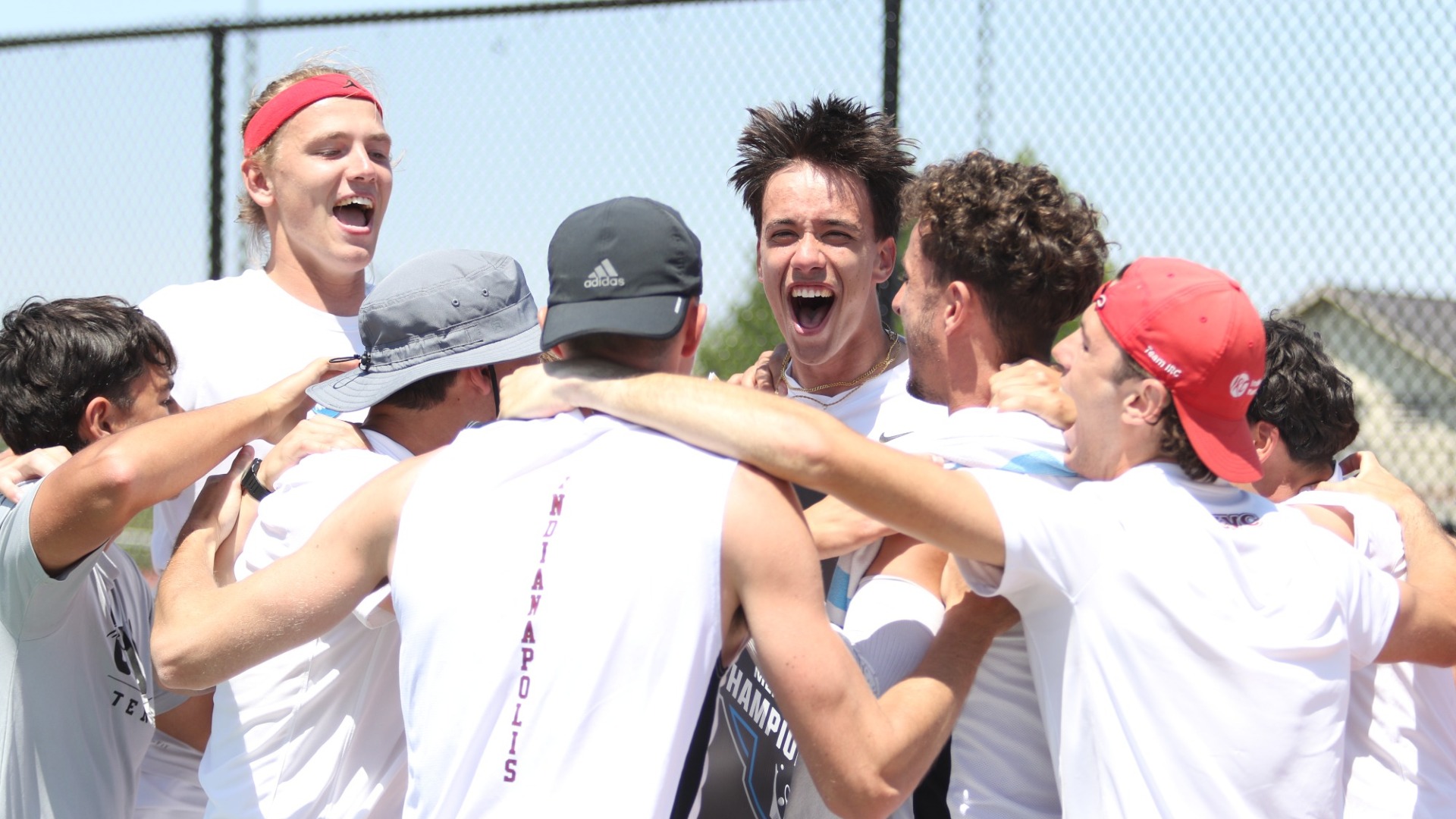 Men's Tennis celebrating Jovan Matovic's win in Regional Final