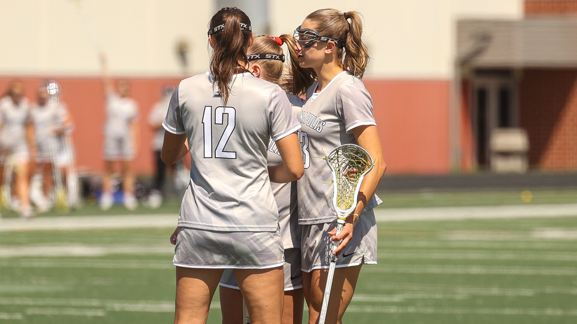 Olivia Bladon, Malaena Michielin and Sage Da Silva celebrating a goal