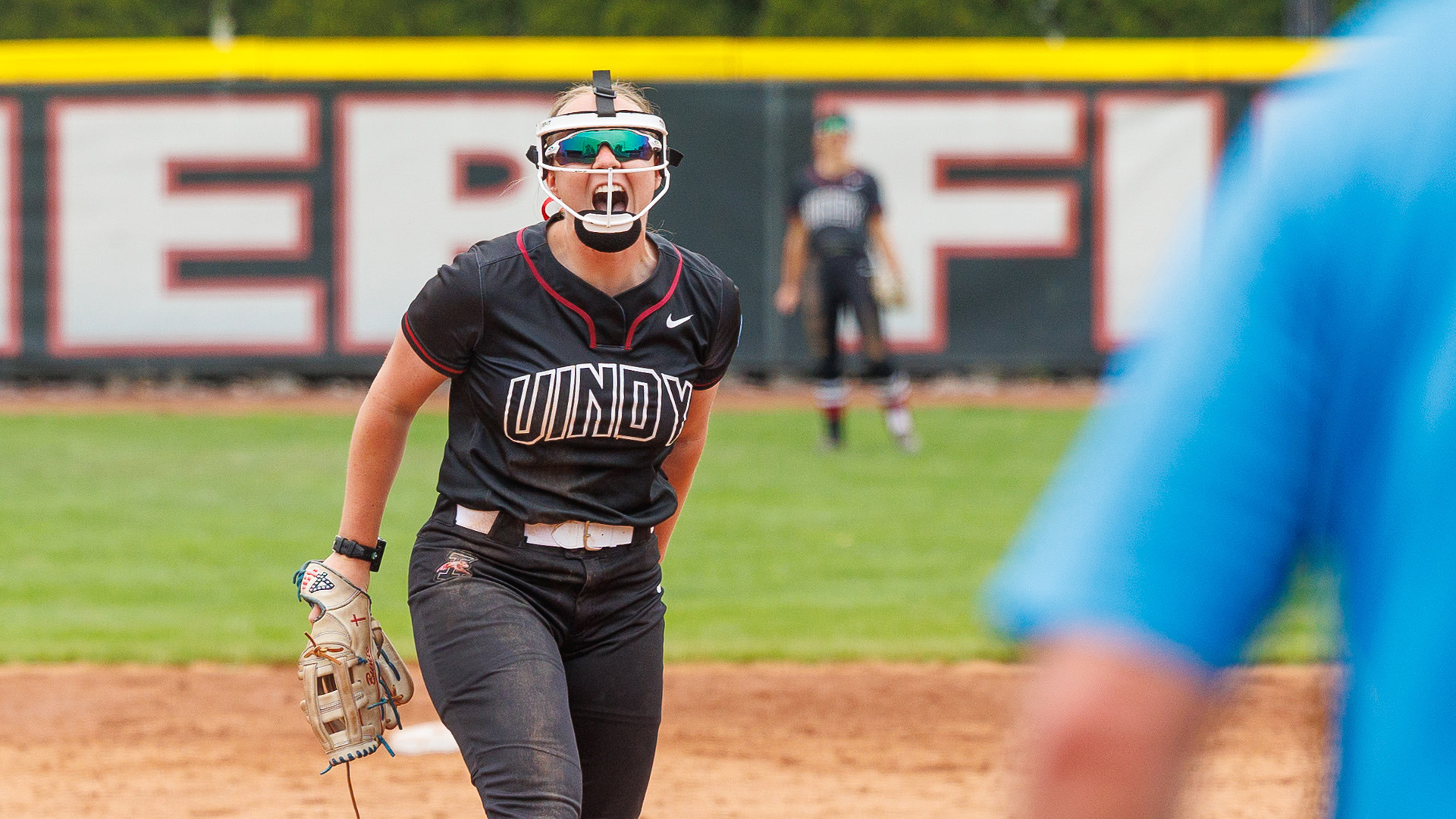 Freshman Caitlin Bunte yelling in celebrating from the pitching circle.