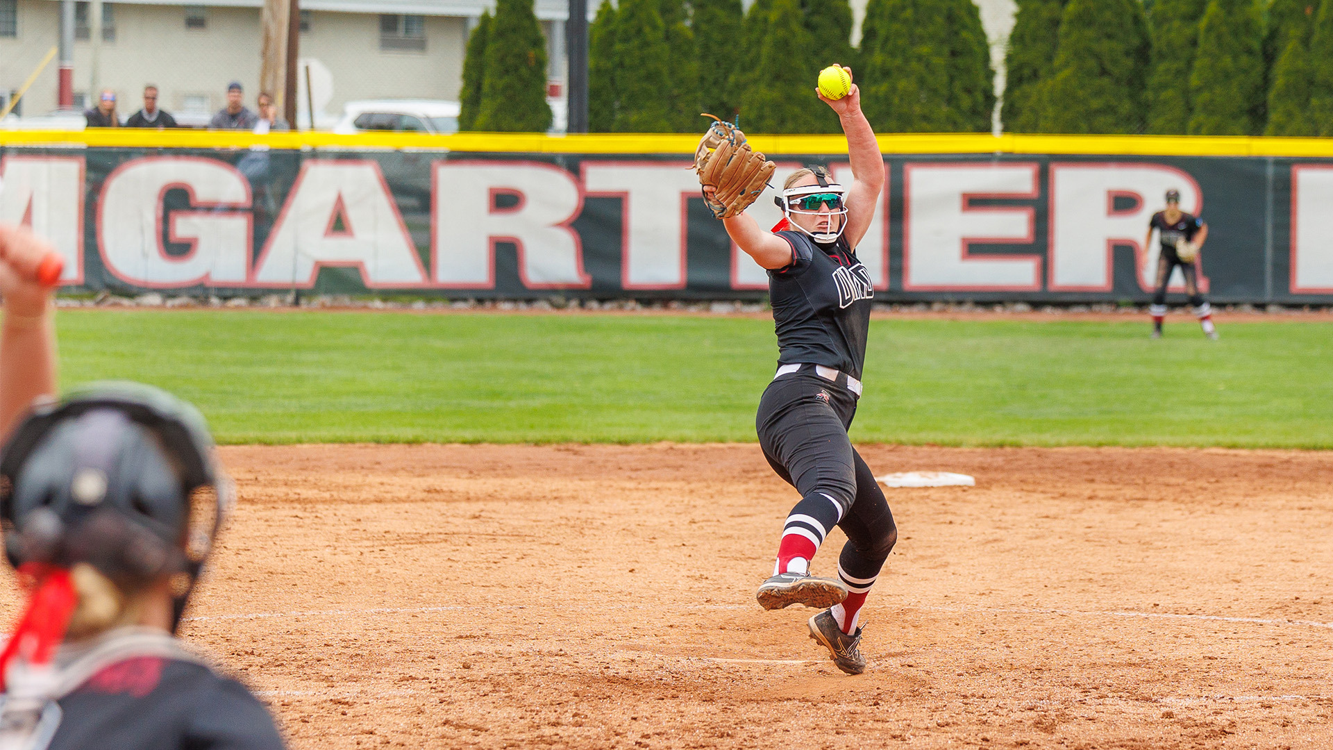 UIndy freshman Caitlin Bunte throwing a pitch versus Saginaw Valley at the 2026 NCAA Midwest Regional.