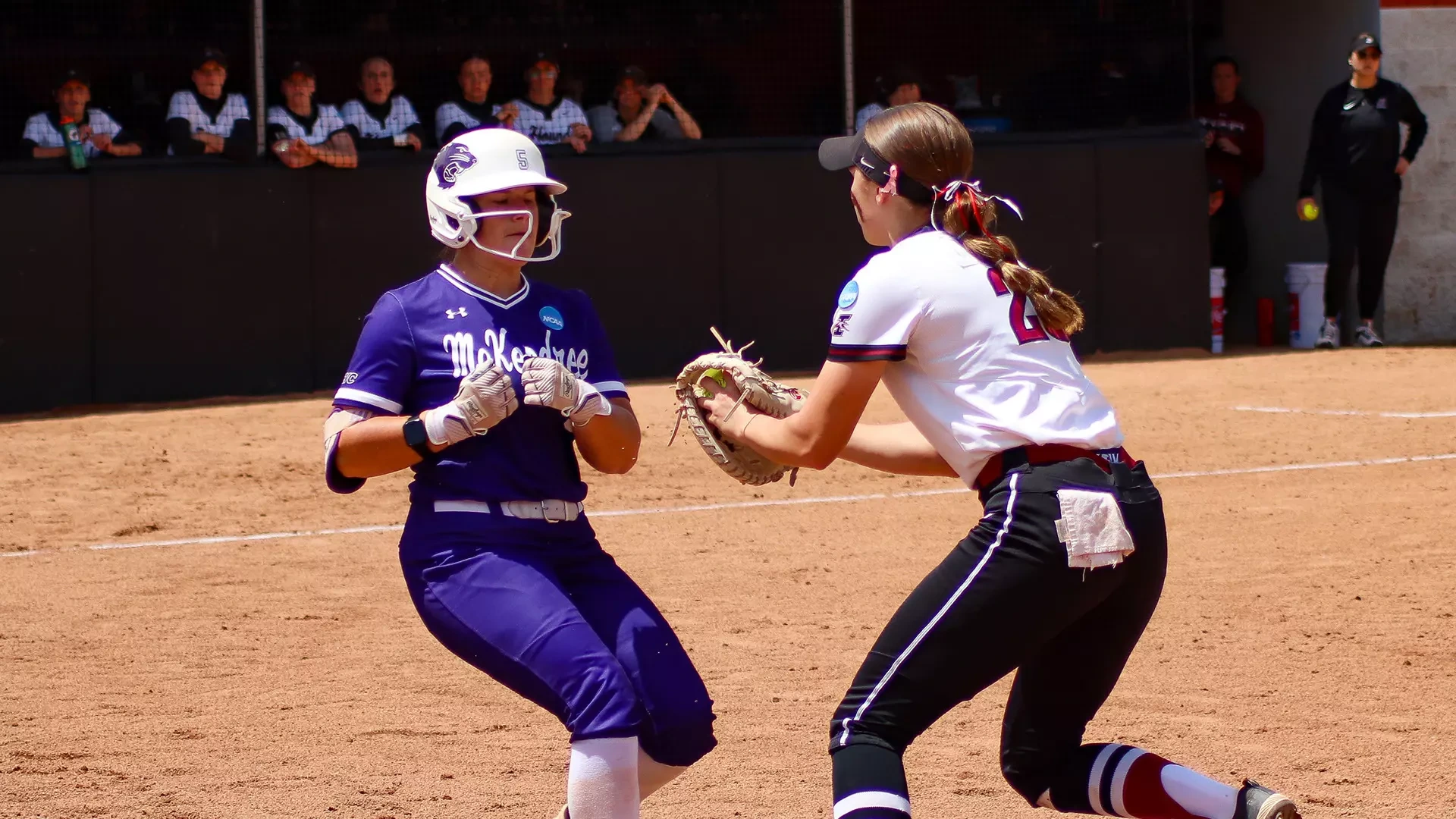 UIndy first baseman Shelby Cook tags a McKendree base runners during the opening game of ht e 2026 NCAA DII Midwest Regional.