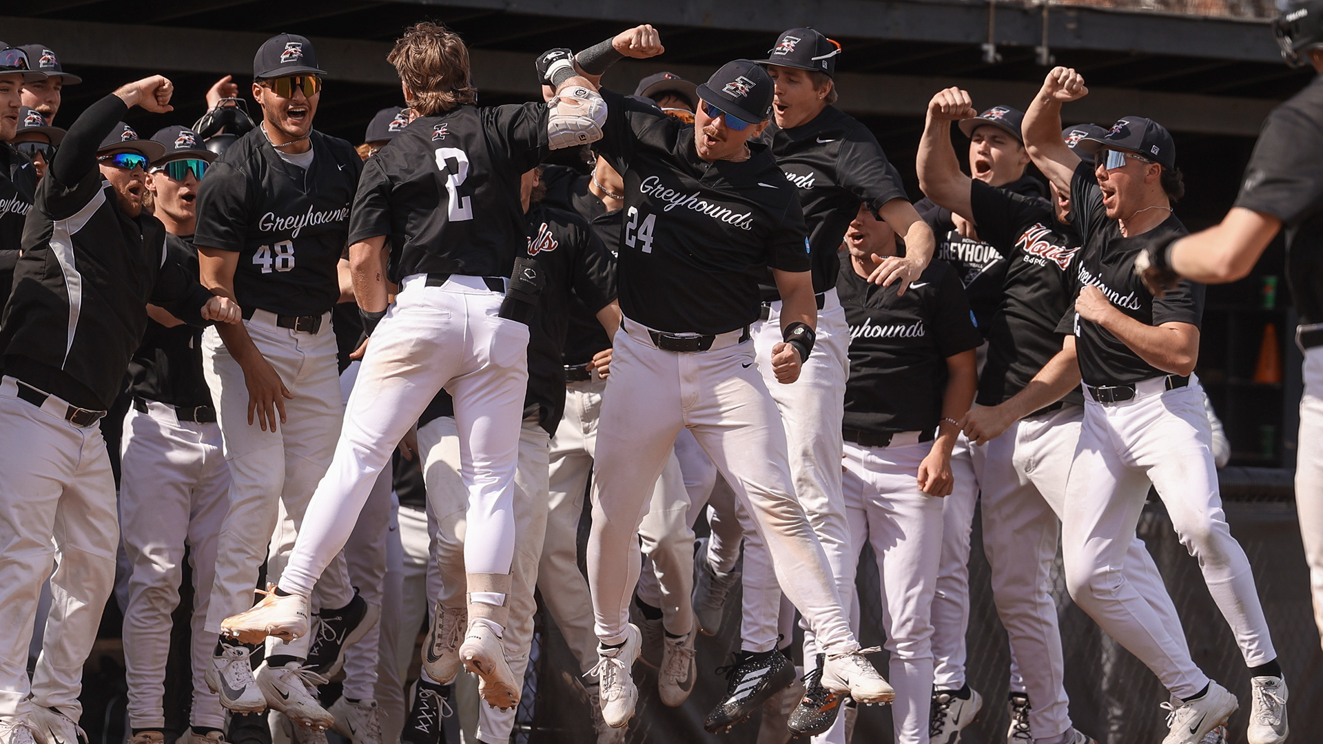Austin Bode and Gavin Duran celebrating a home run with the team