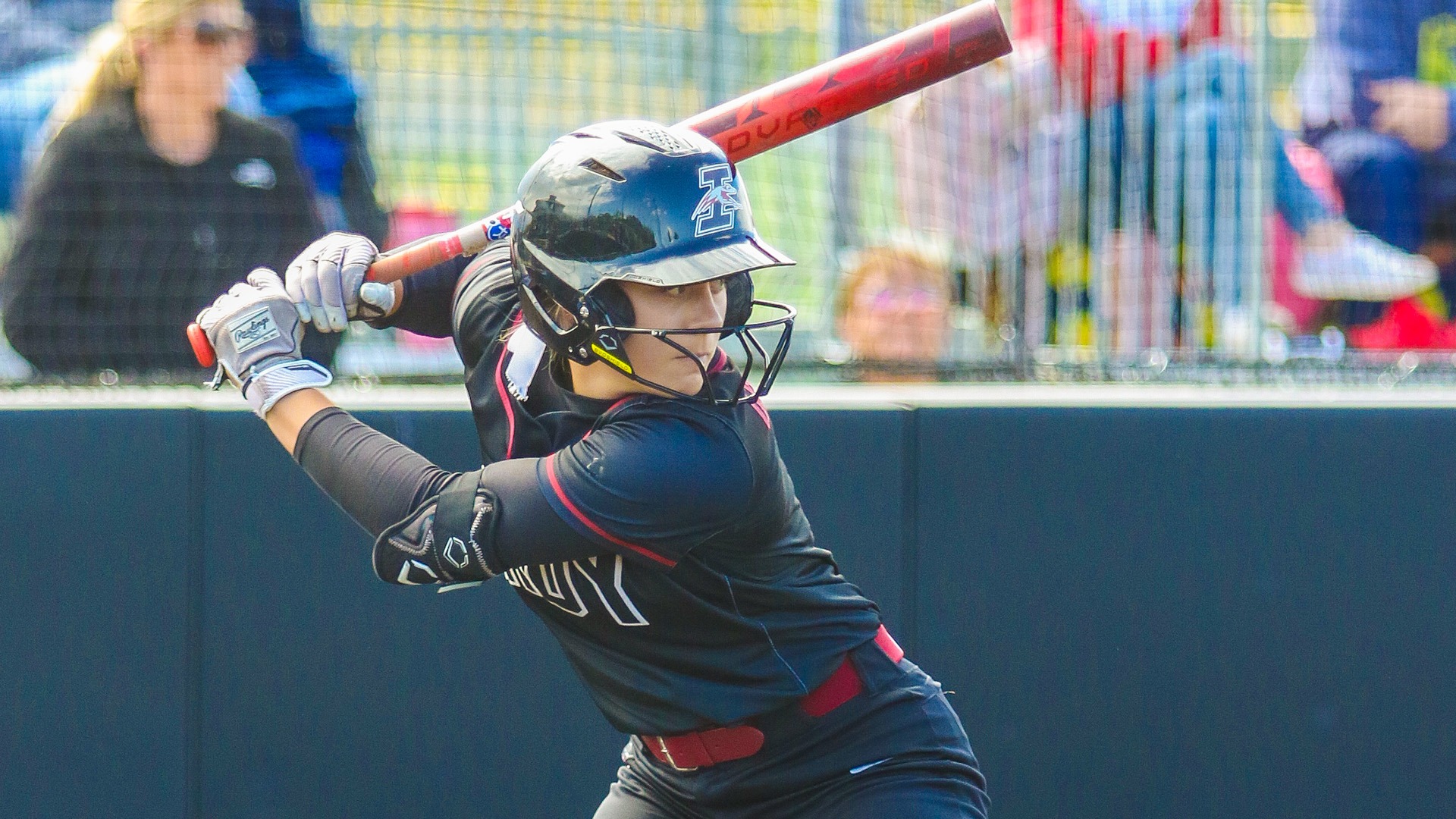 UIndy softball sophomore Brooklyn Willis in the batter's box.
