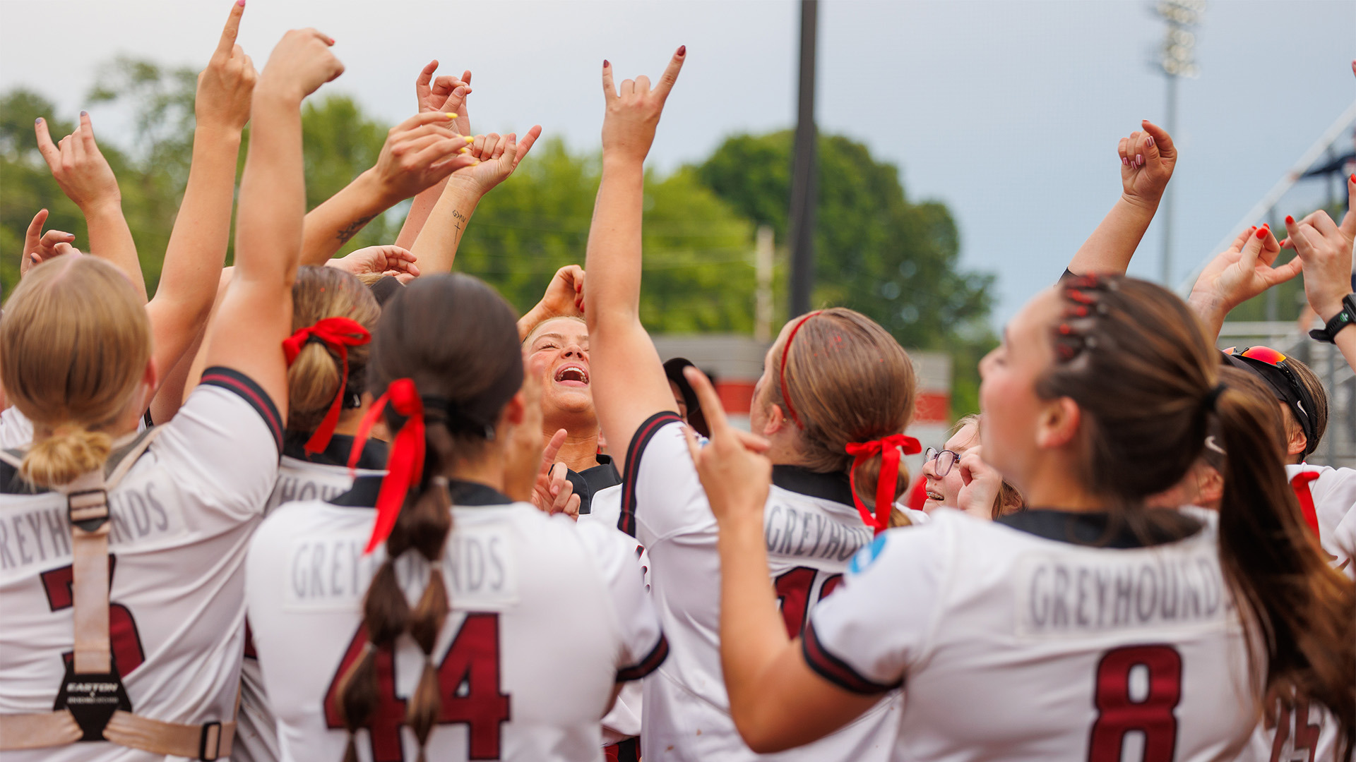 Members of the UIndy softball team celebrating.