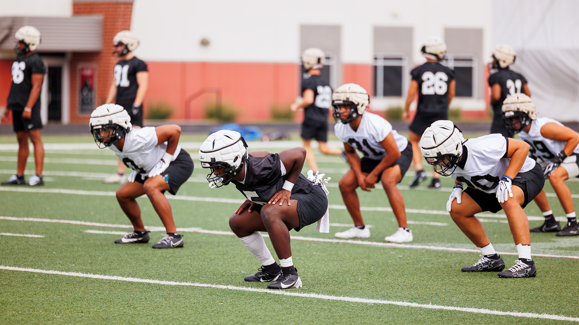 Member of the UIndy football team warming up at practice.