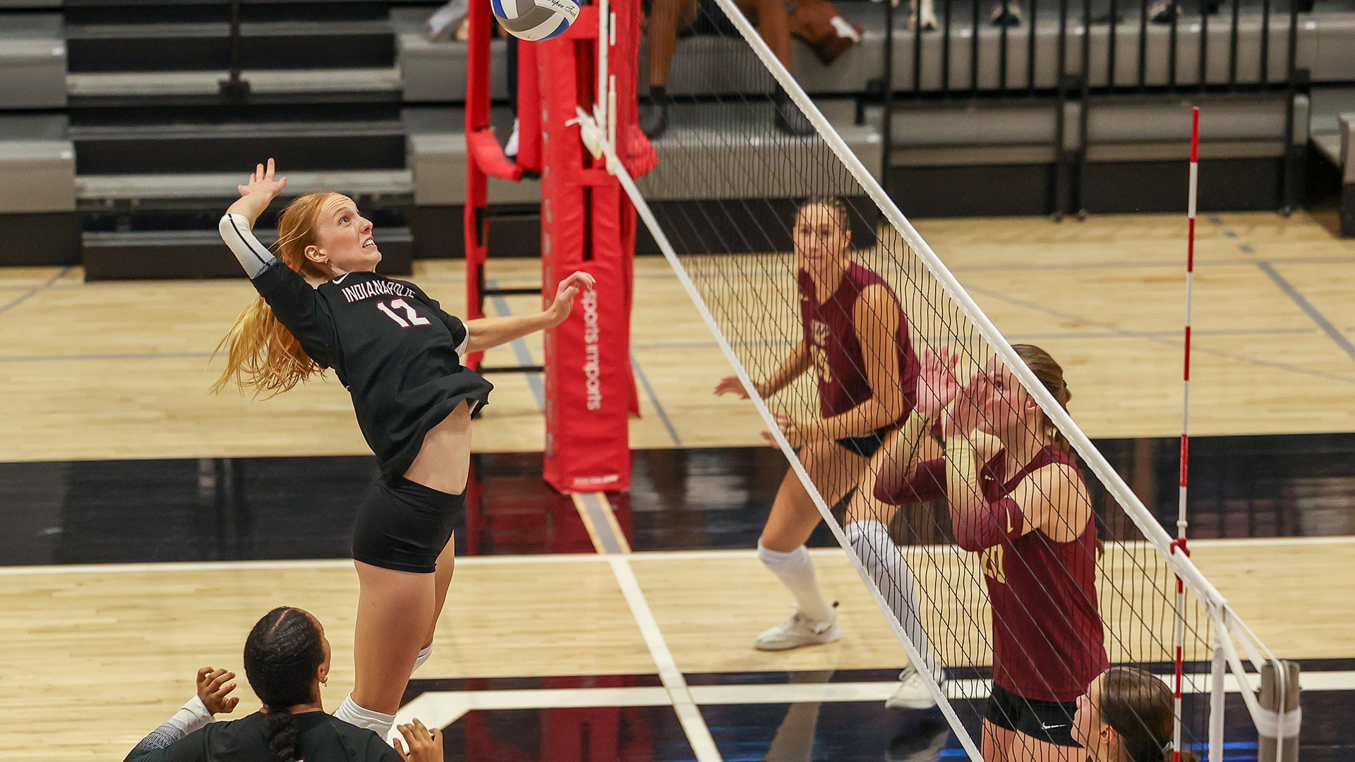 Allison Jansen attacks at the net