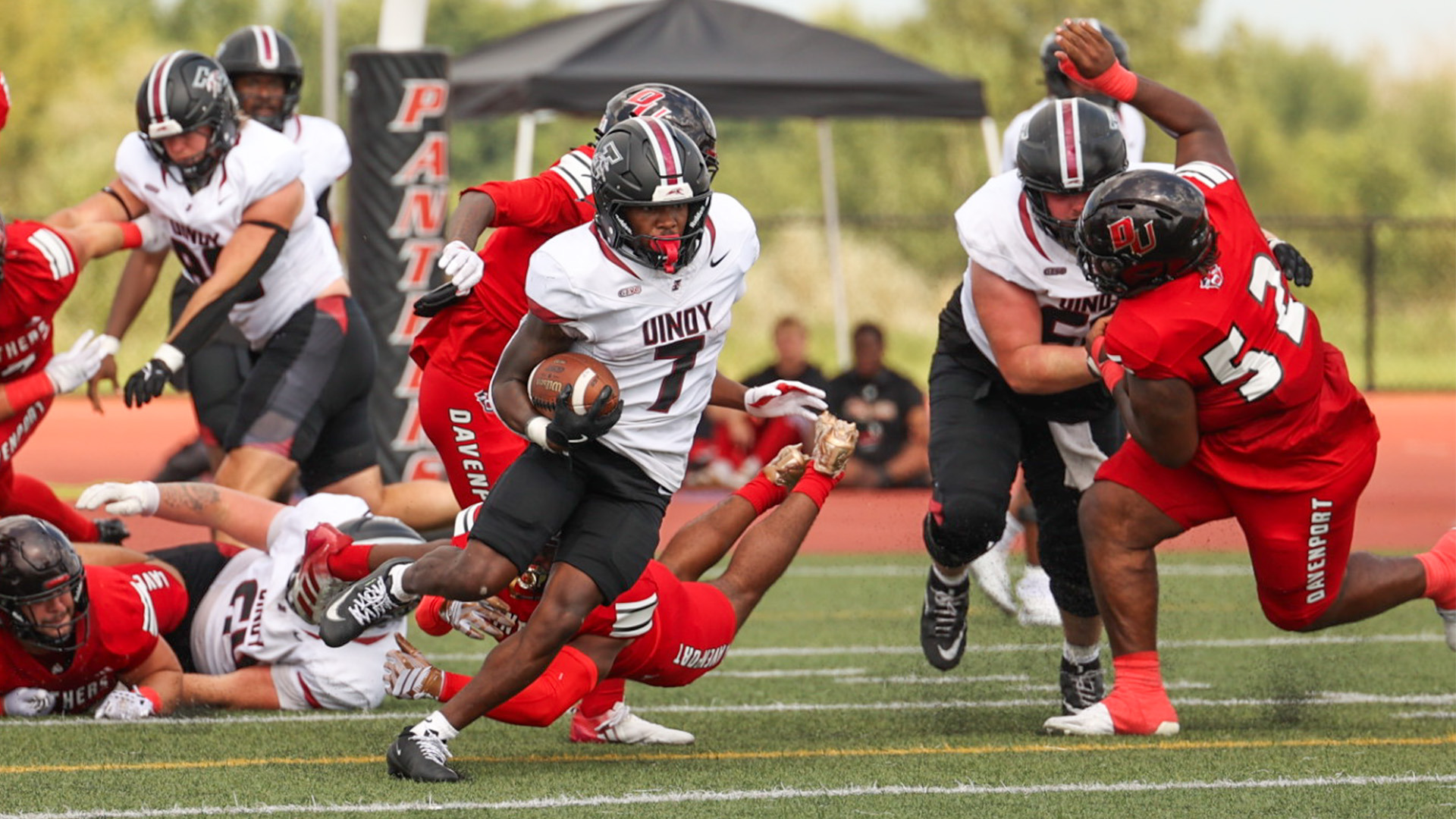 UIndy running back Garrett Sherrill carrying the ball at Davenport.
