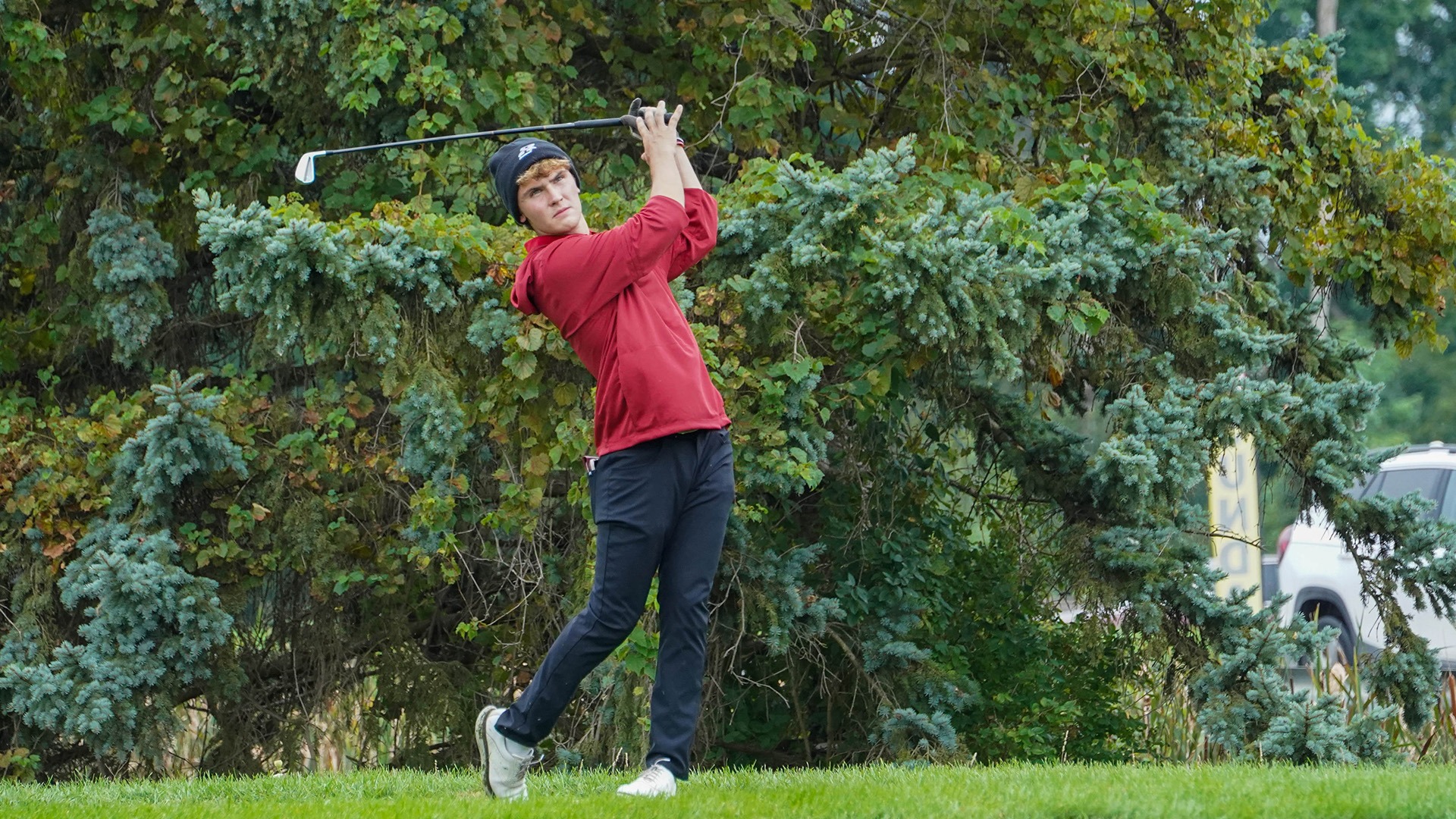 UIndy golfer Jacoby Schmidlapp hitting an iron off the tee.