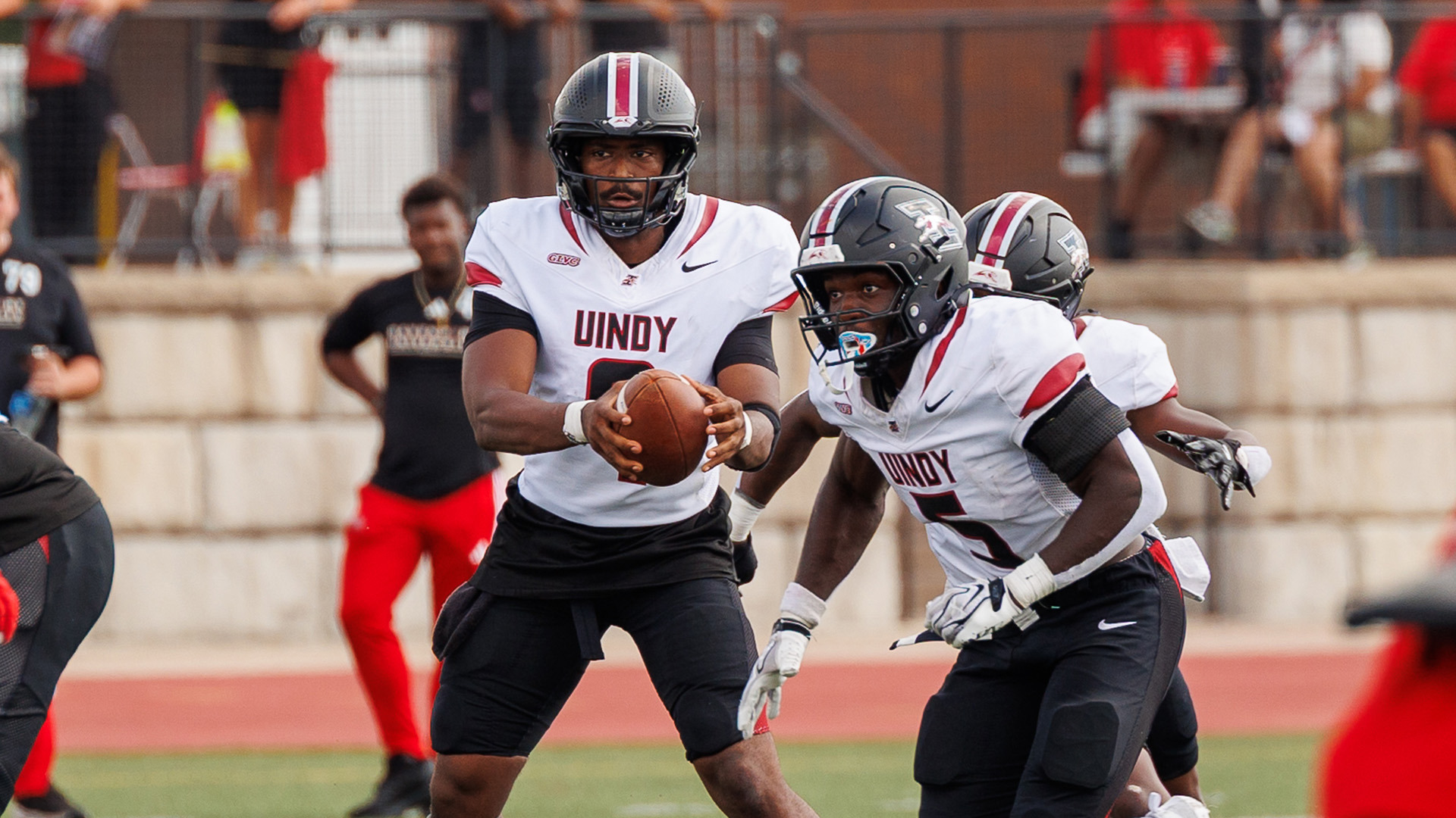 UIndy quarterback Nick Patterson and running back Juseters Fataki