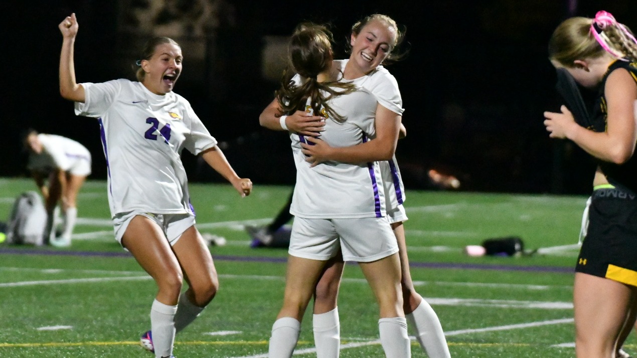 Women's soccer celebrates goal against UWO