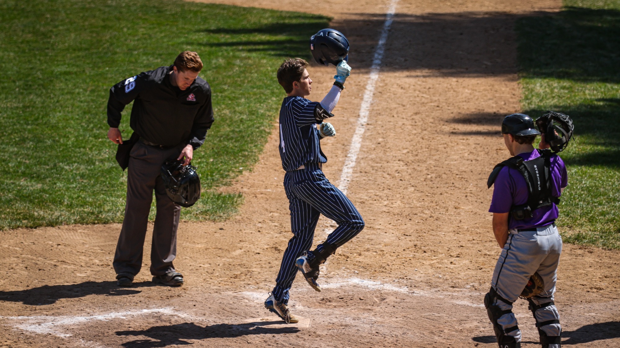 Kevin Zanin touches home plate