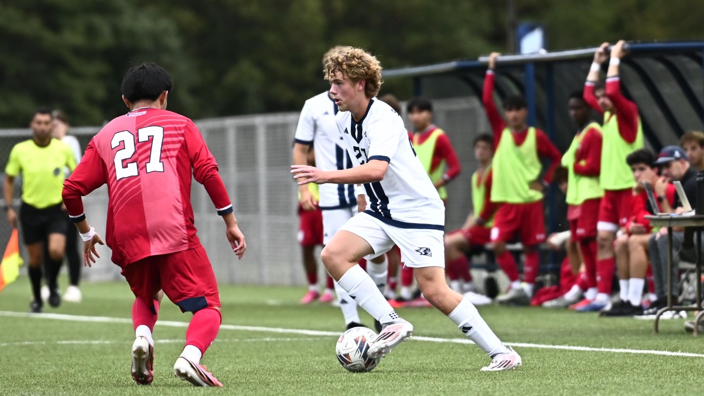 Landan moves the ball around a defender