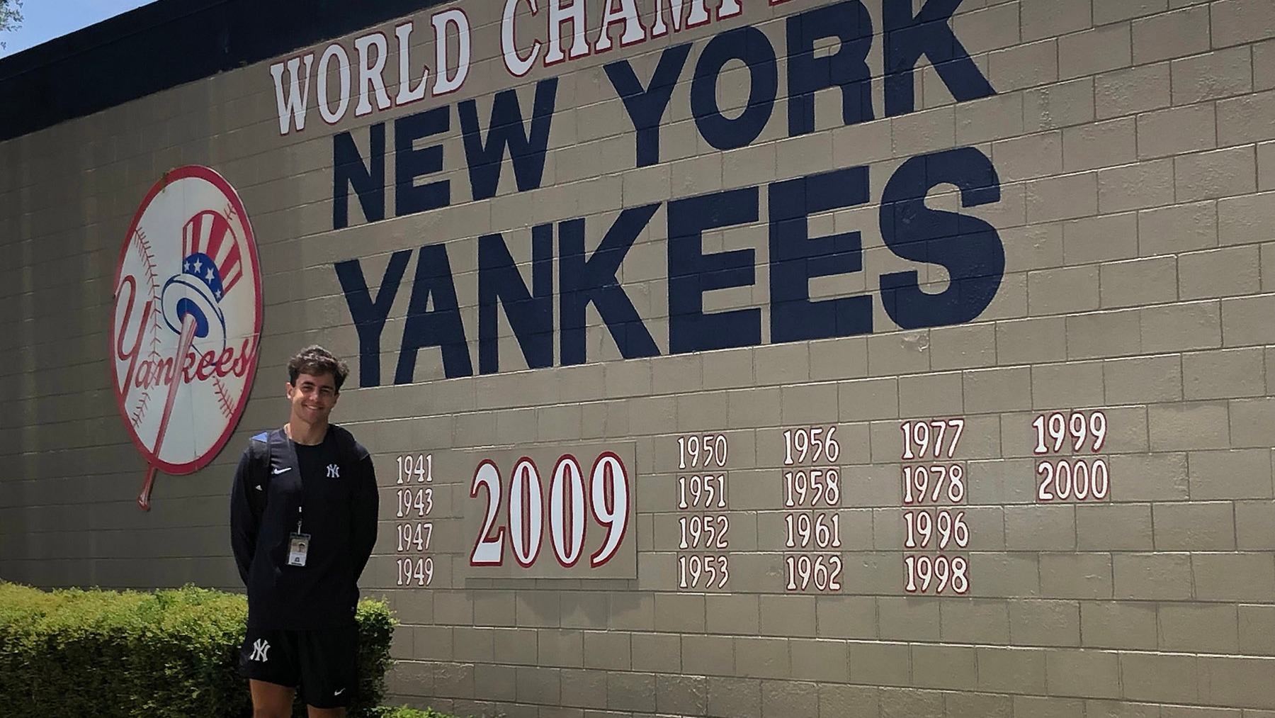 leuzinger infront of yankees sign
