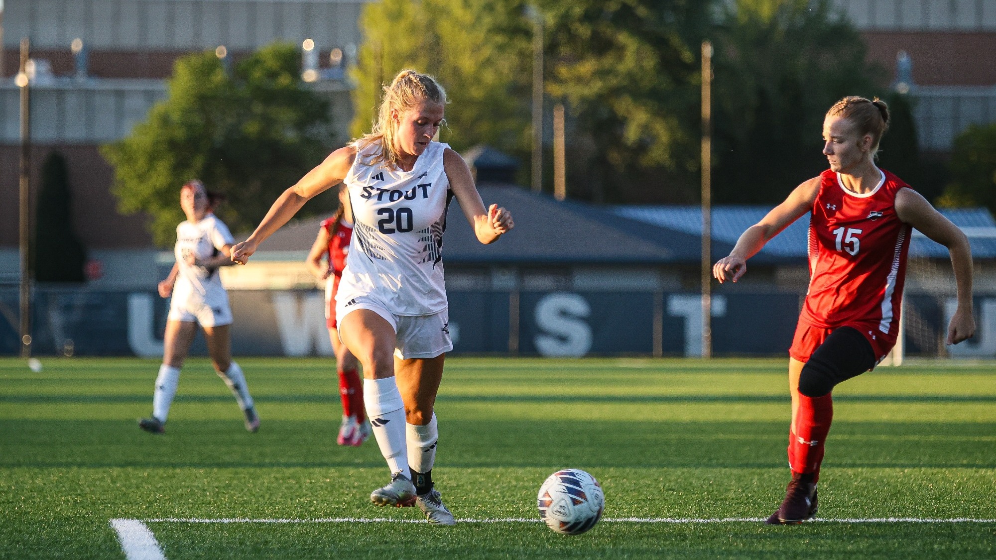 Kasey Stauner moves the ball past a defender