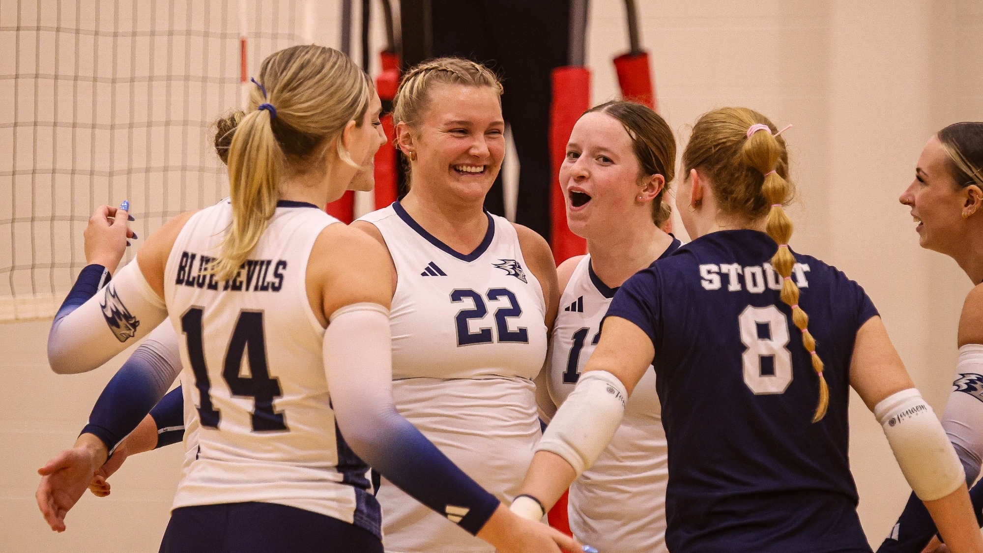 blue Devils celebrate a t point vs Mount Mary