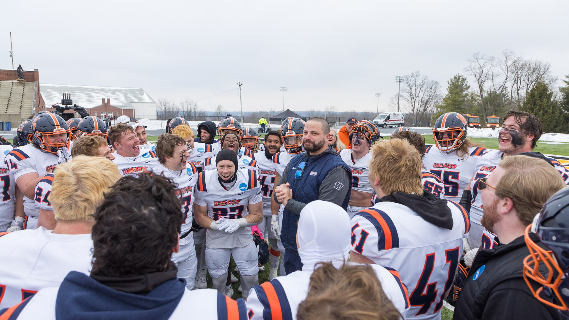 Wheaton Football team huddle