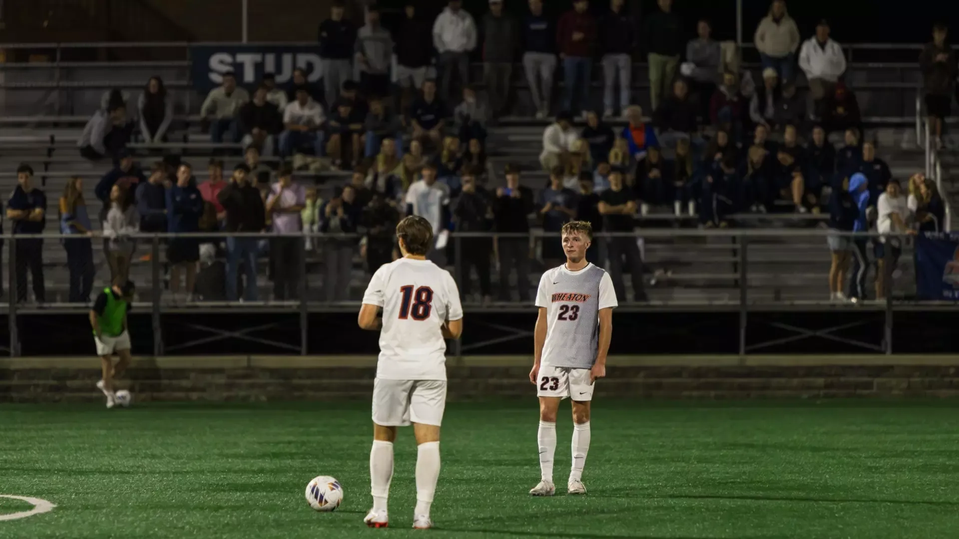 Men's Soccer free kick with crowd