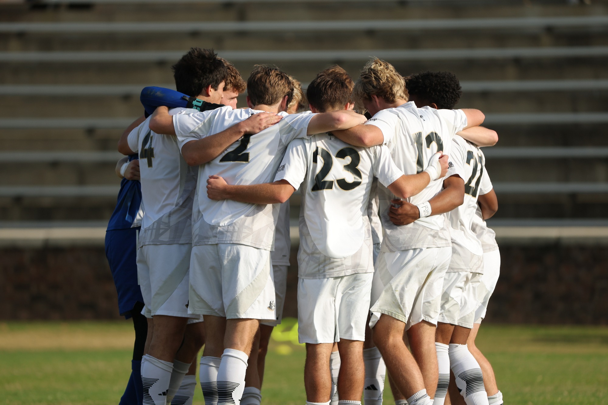 Team huddle at Furman SoCon